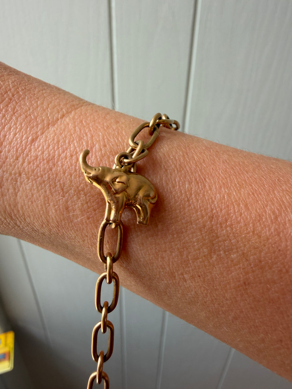 18k gold oval link with puffy elephant bracelet