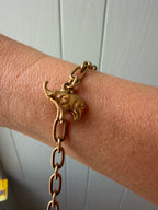 18k gold oval link with puffy elephant bracelet