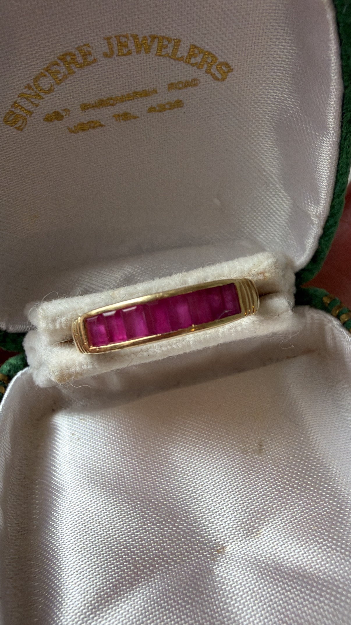 emerald cut ruby and gold band