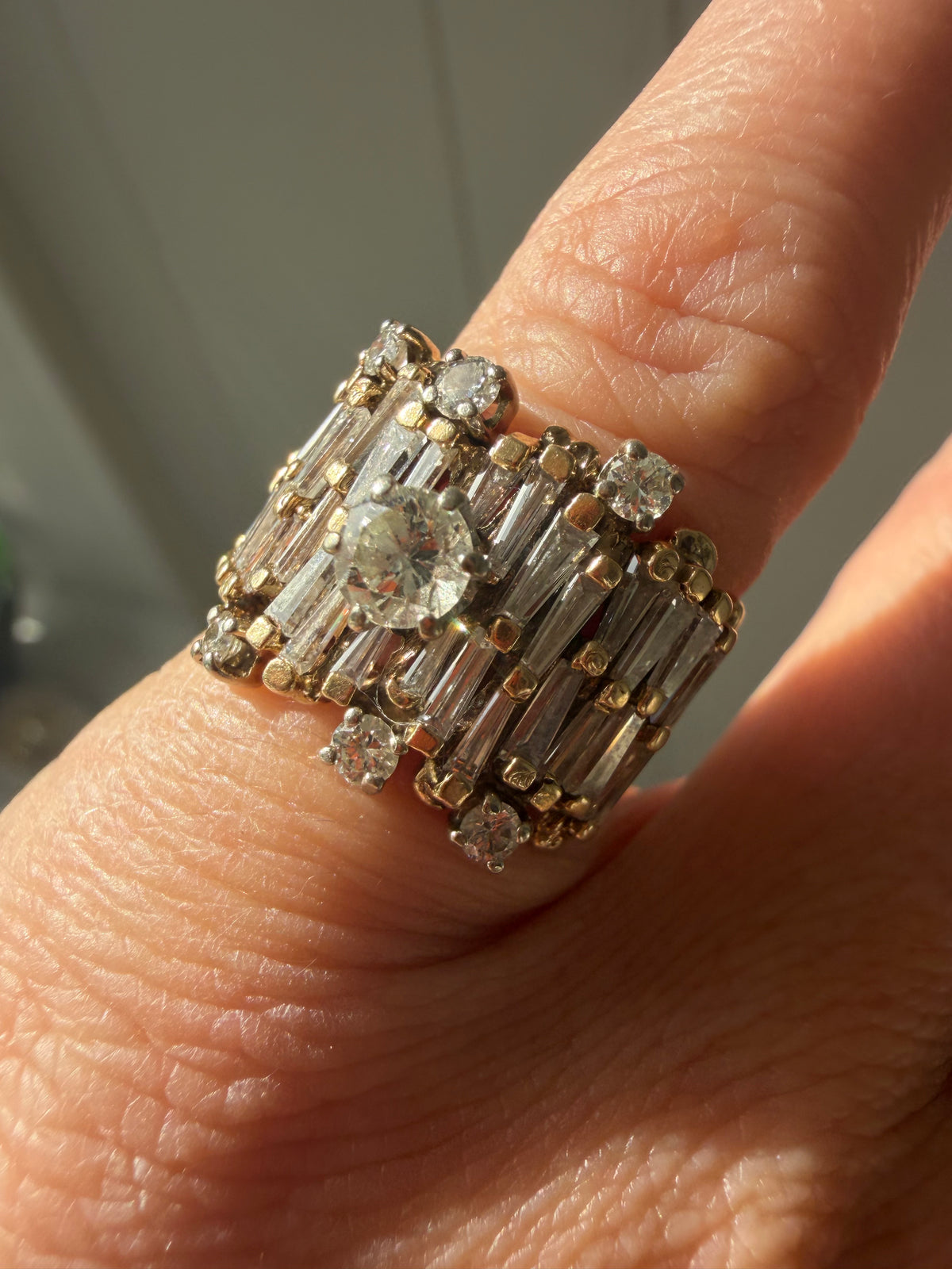 brutalist era baguette and round diamond ring
