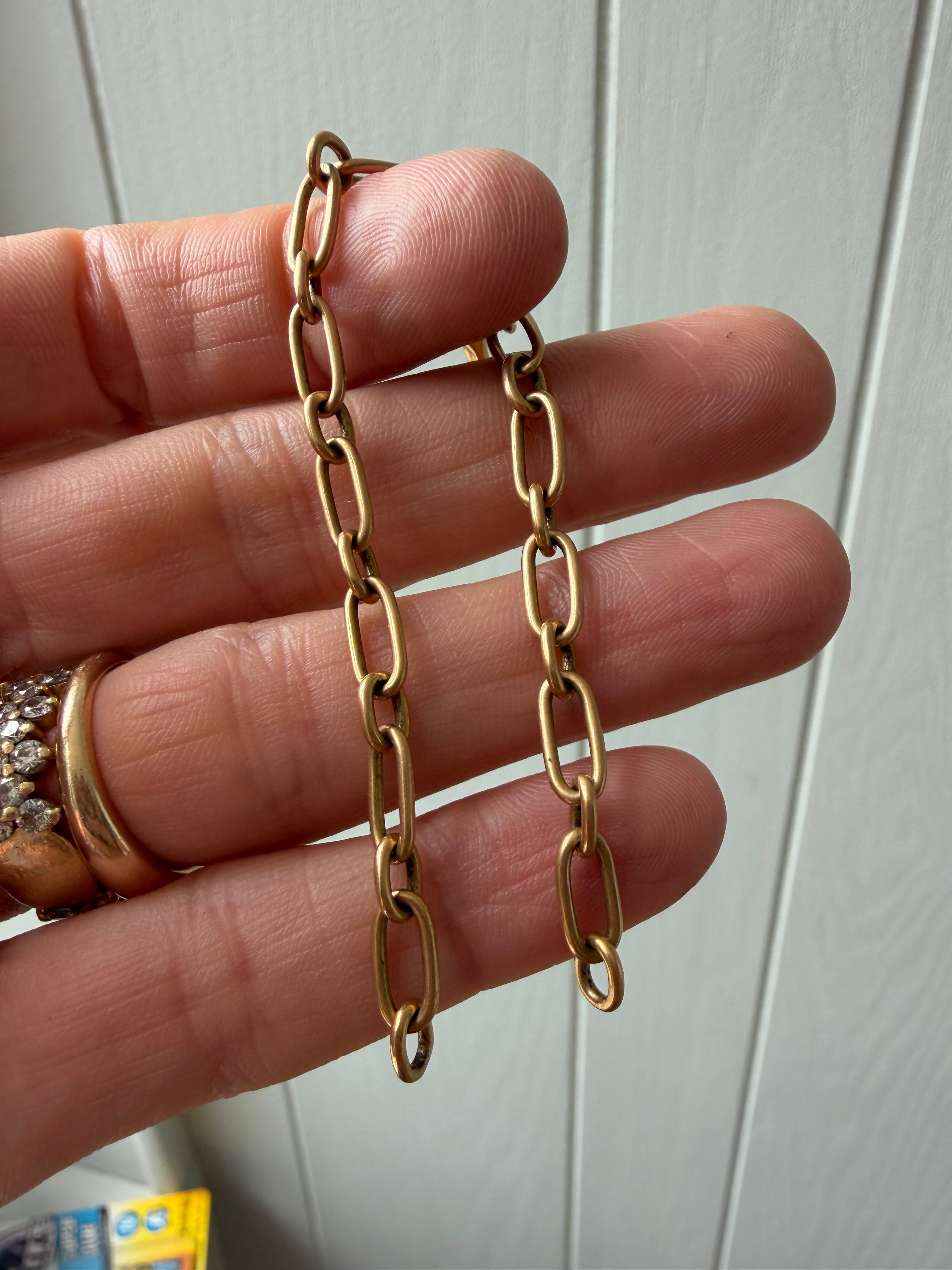 18k gold oval link with puffy elephant bracelet