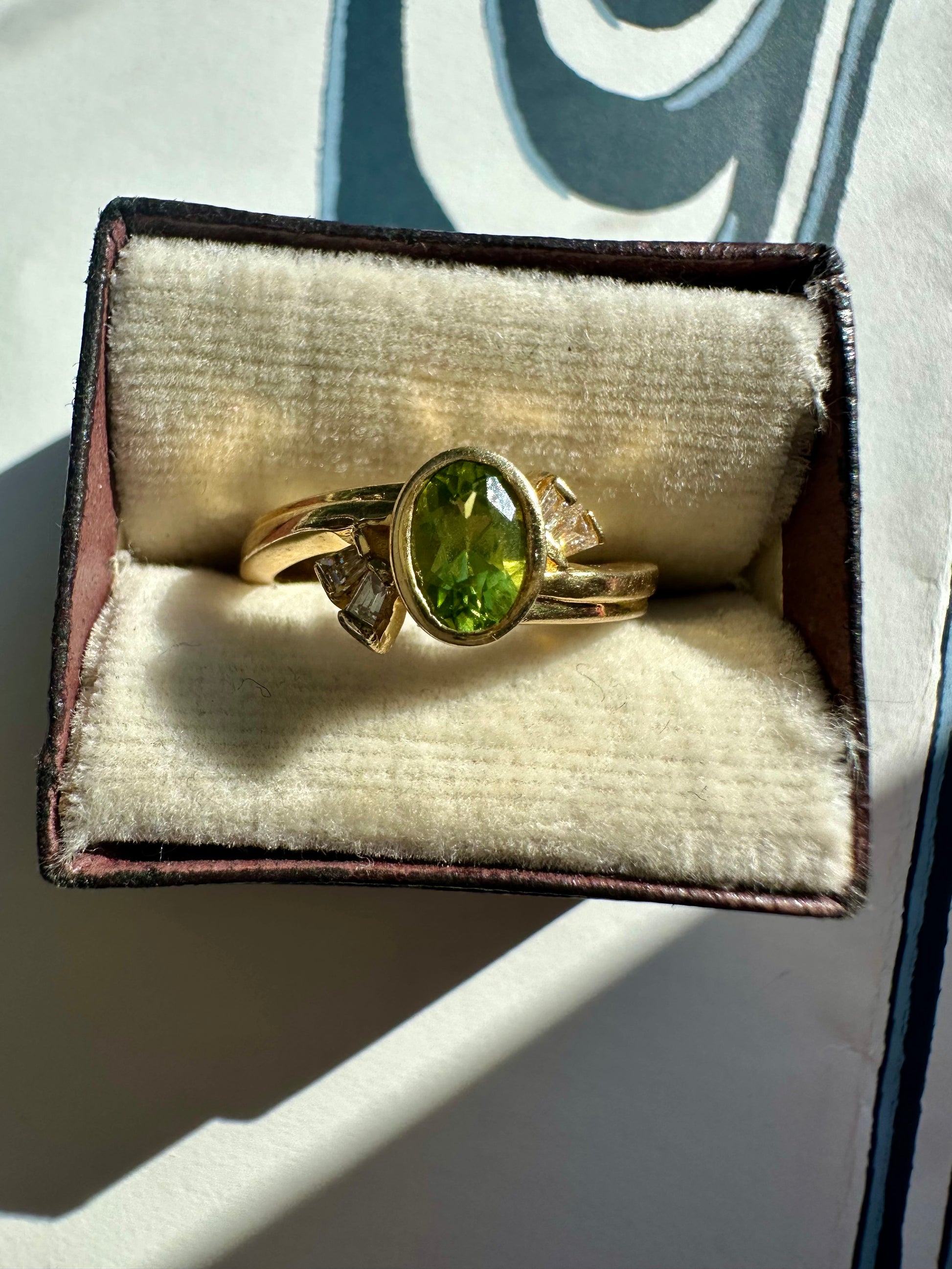 bezel set peridot and diamond ring