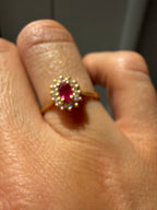 oval cut ruby with natural diamond halo