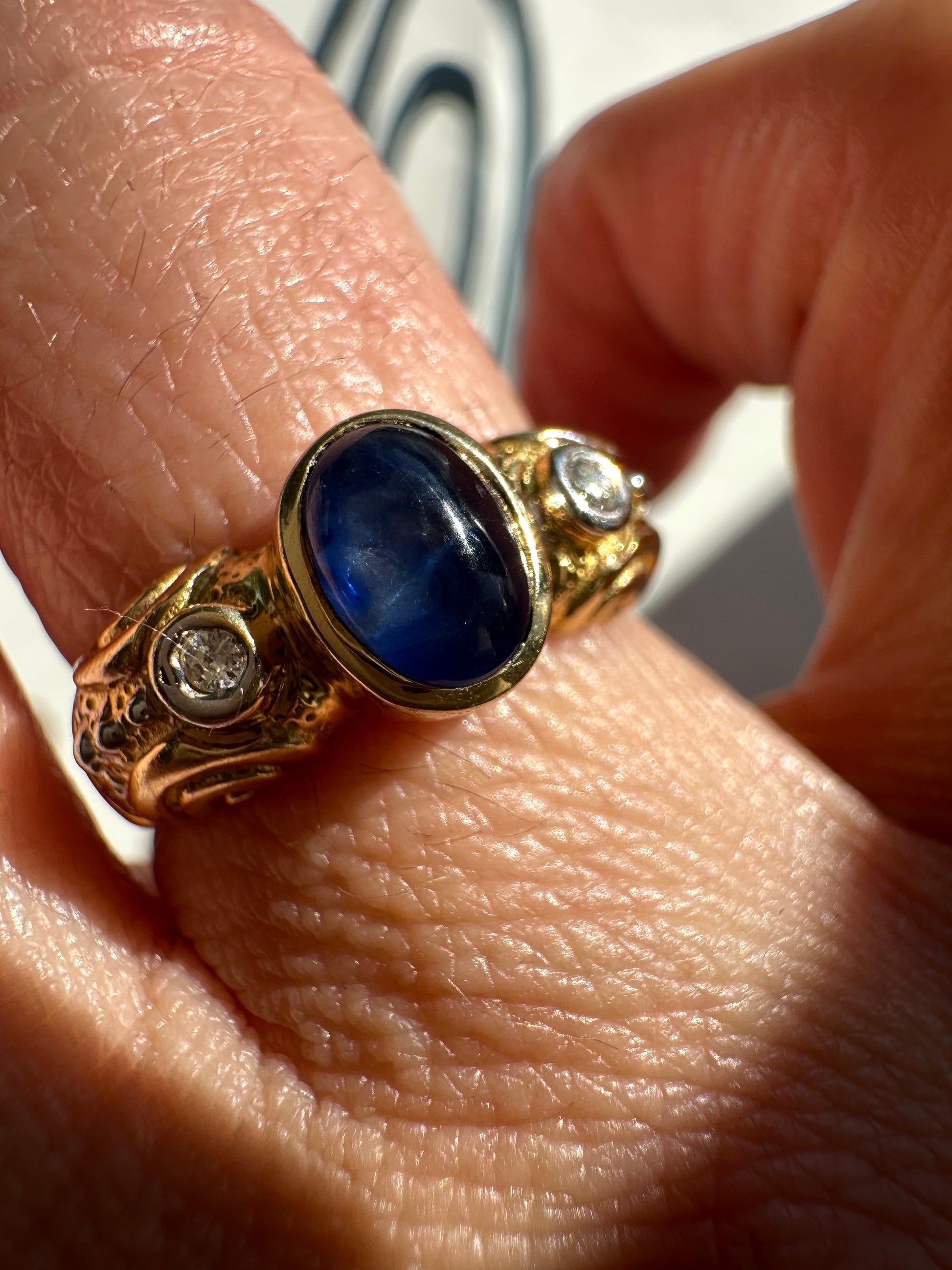 sapphire cabochon and bezel set diamonds