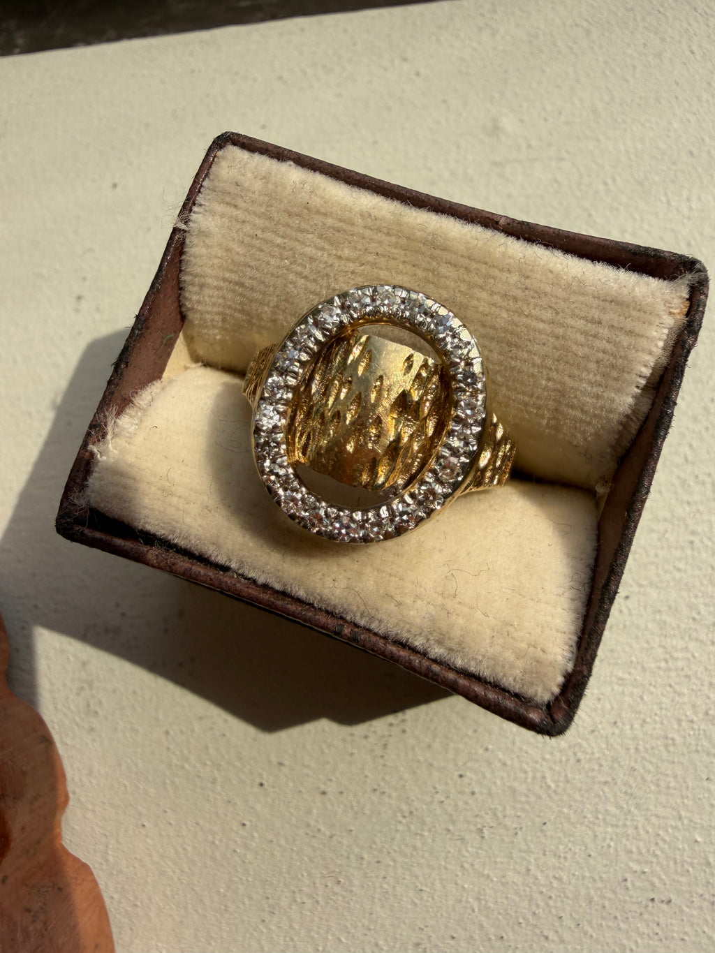 diamond oval and gold textured ring