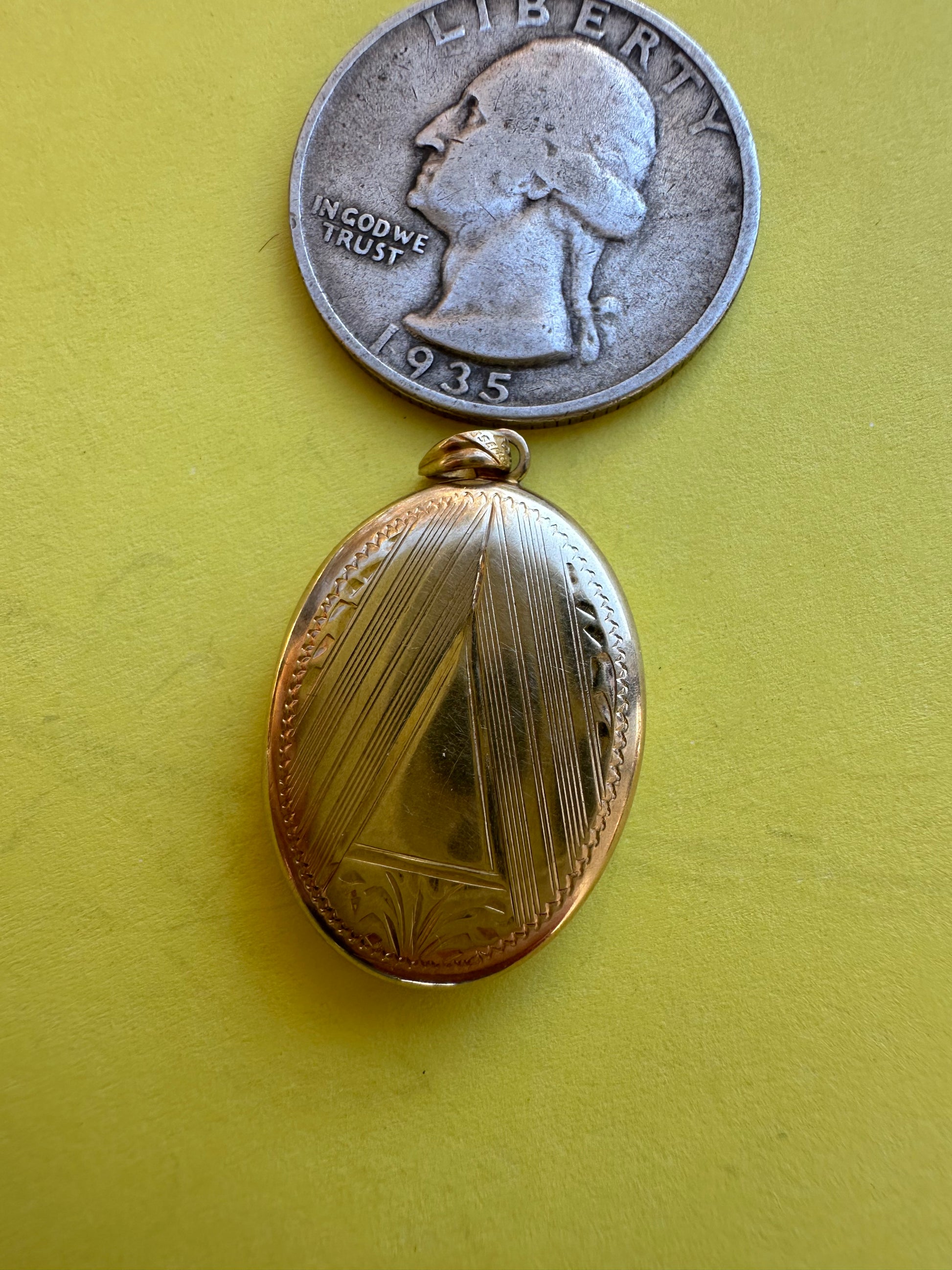 vintage oval locket with triangle