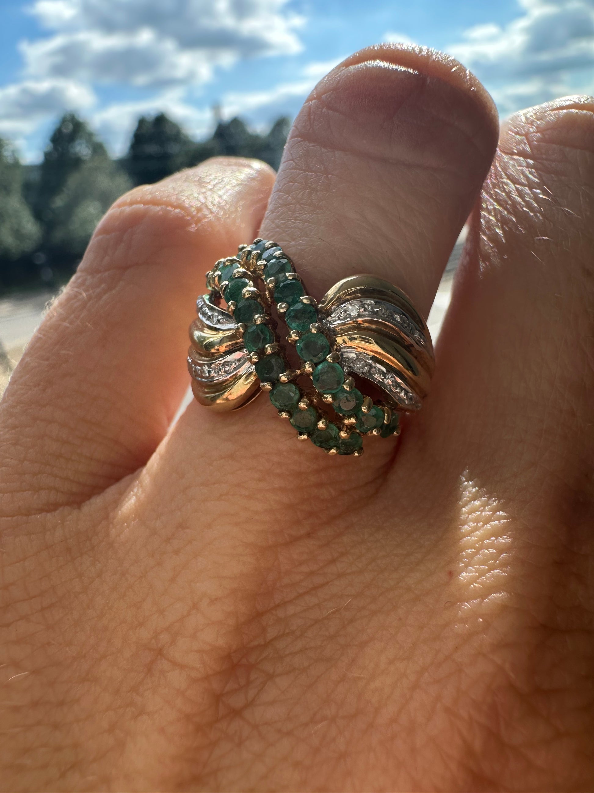 emerald and diamond swoop ring