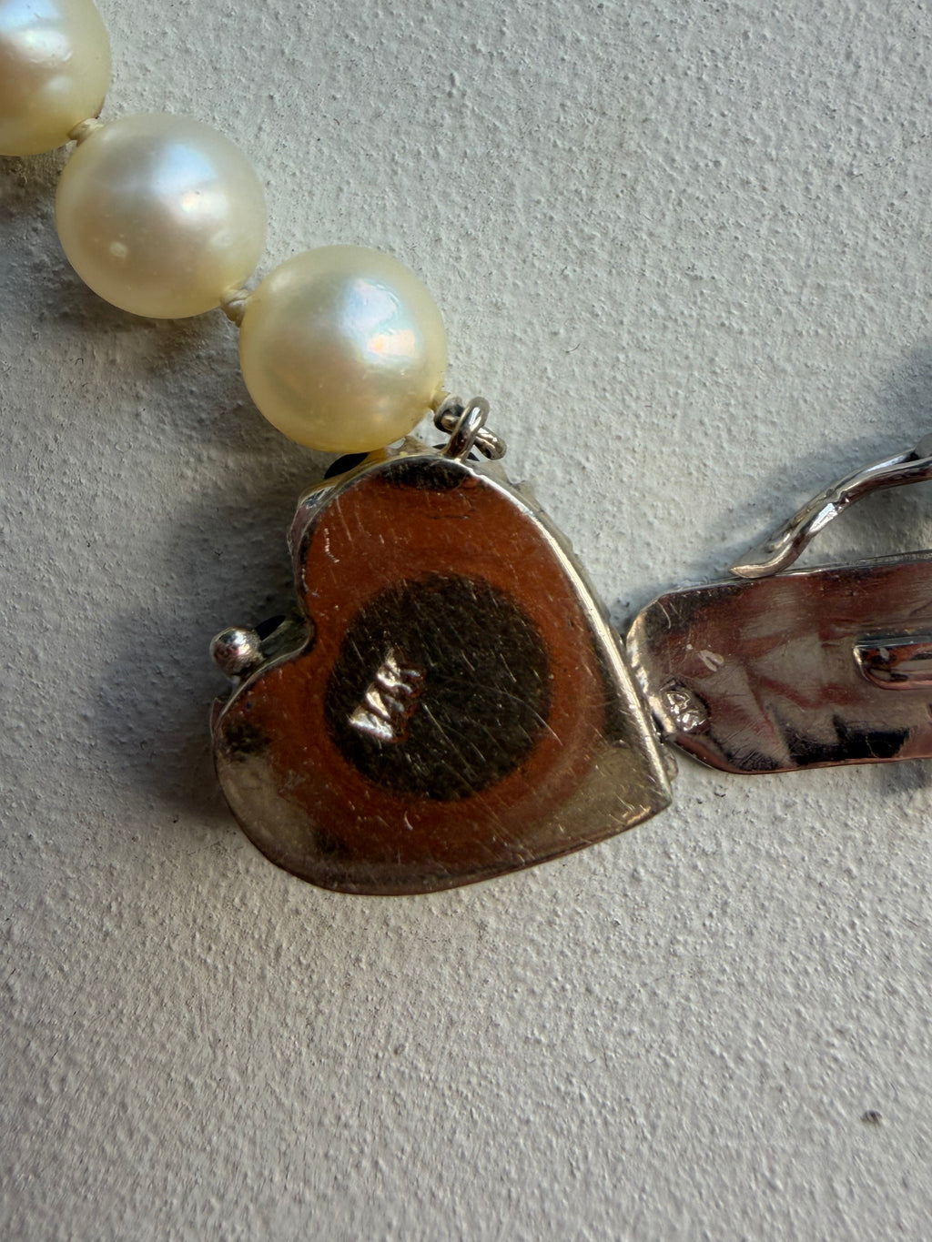 pearl strand with sapphire and pearl heart white gold clasp