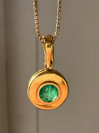 emerald in 18k bezel