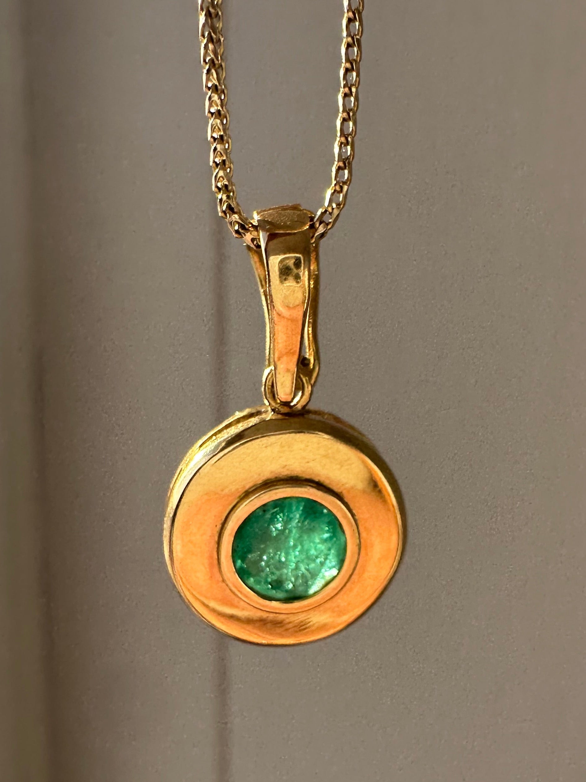 emerald in 18k bezel