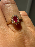 oval cut ruby with natural diamond halo