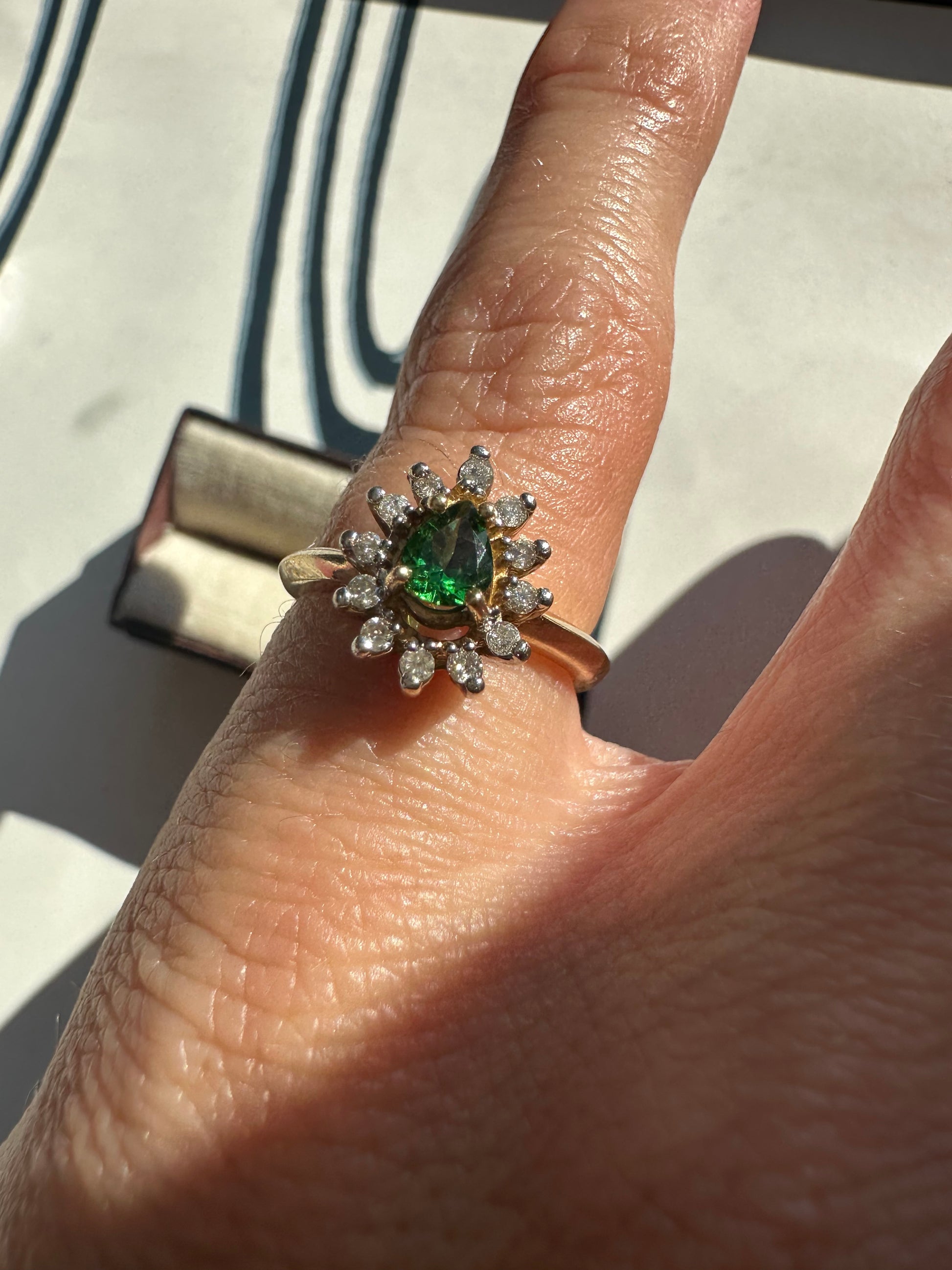 tsavorite garnet and diamond halo ring