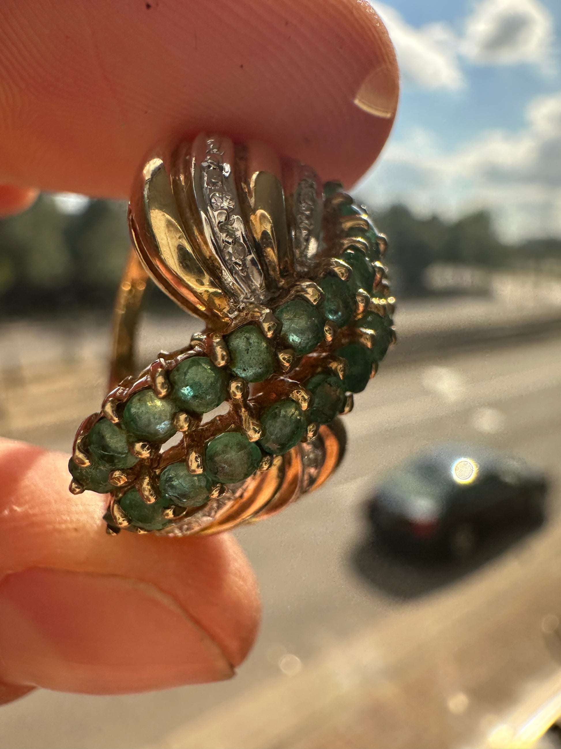 emerald and diamond swoop ring