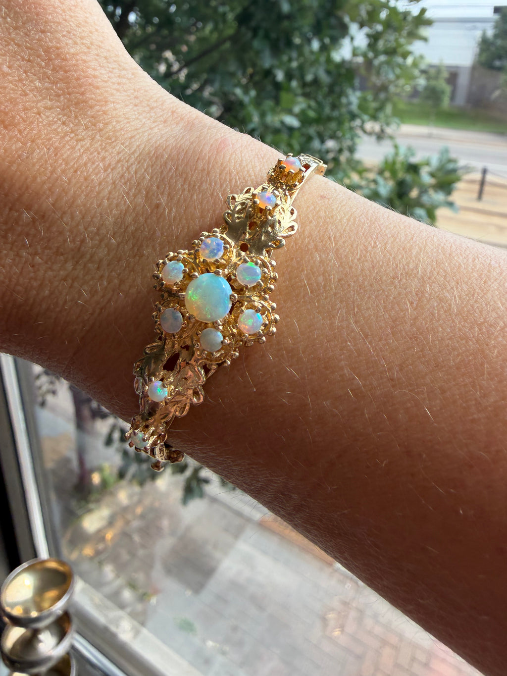 striking engraved opal burst hinge bangle