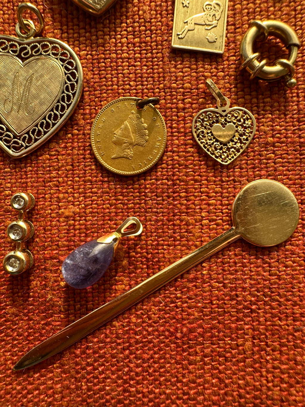 plethora of vintage gold charms