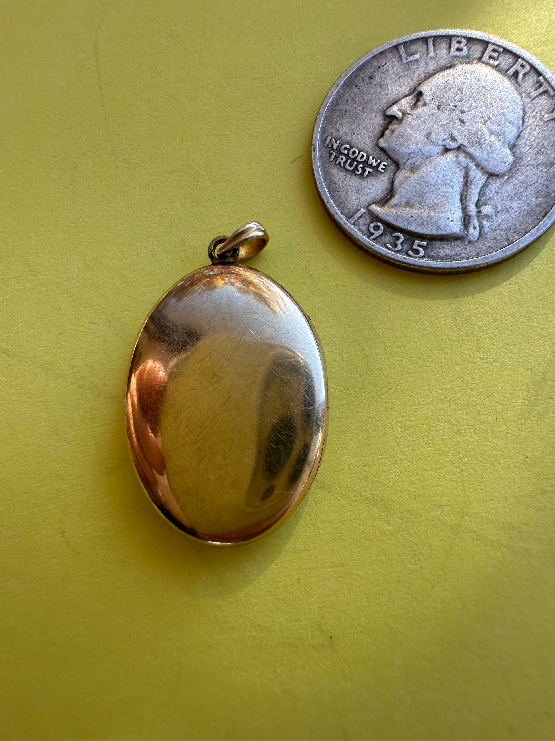 vintage oval locket with triangle
