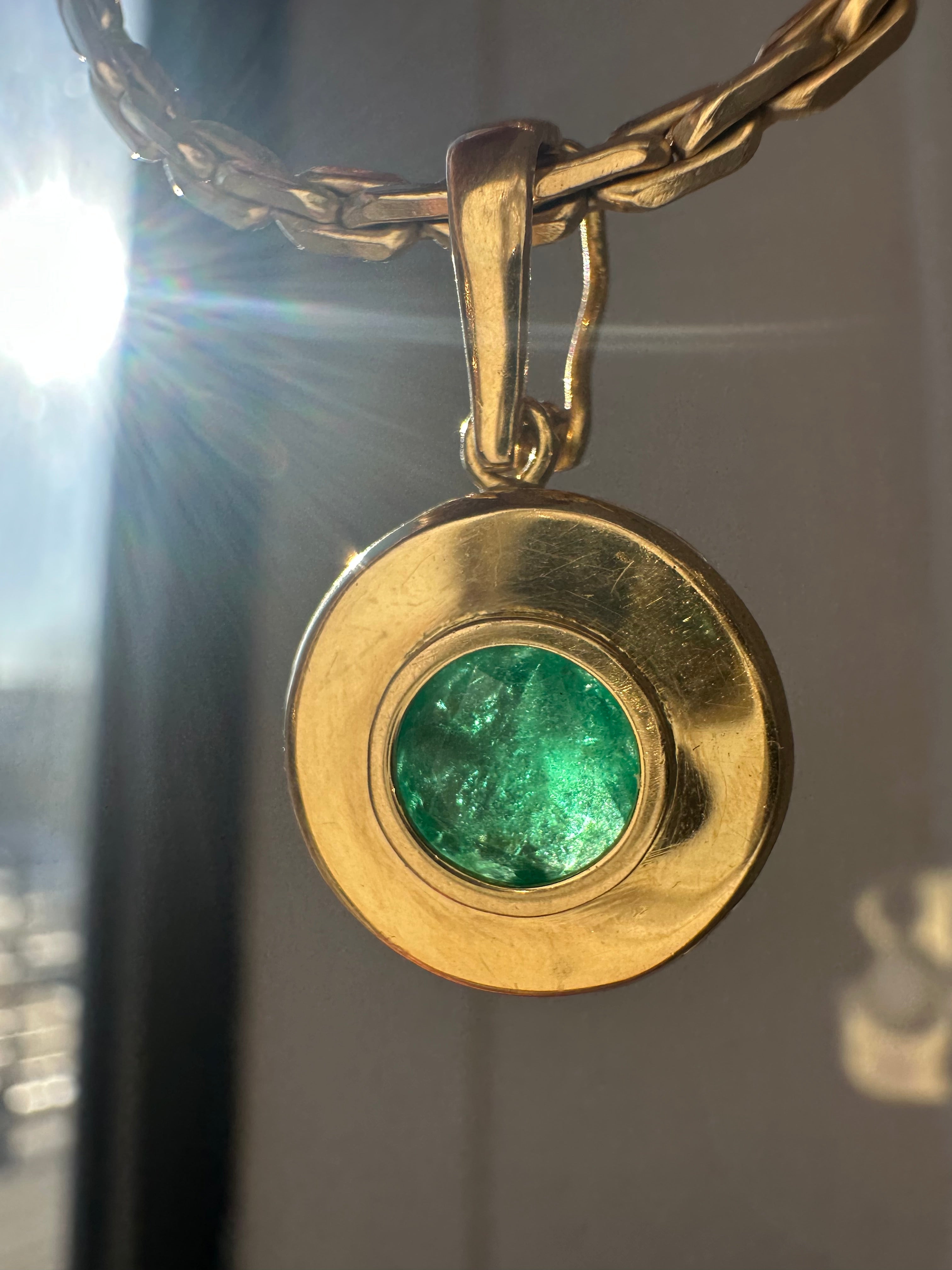 emerald in 18k bezel