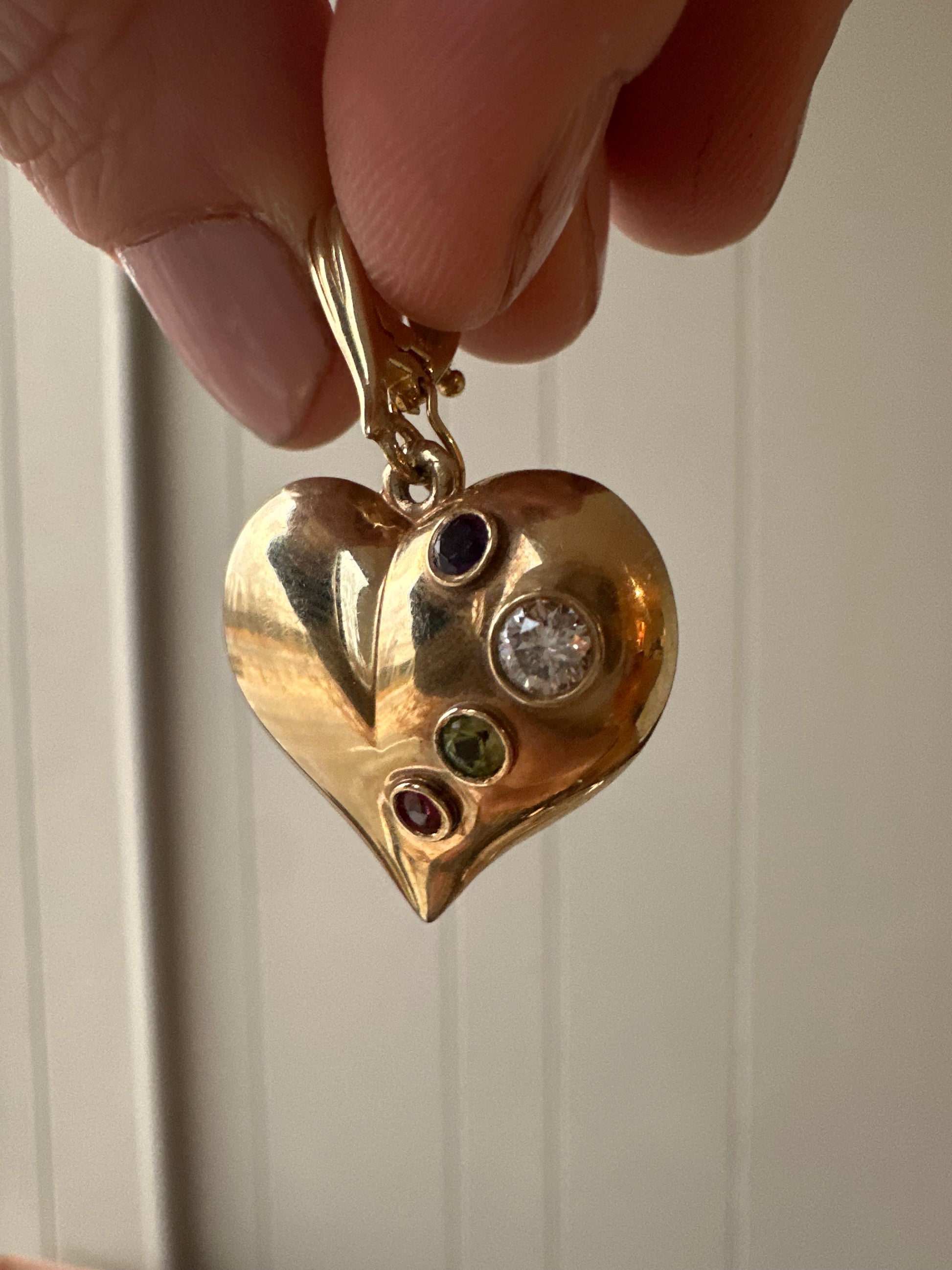 large puffed heart with gemstones and diamond