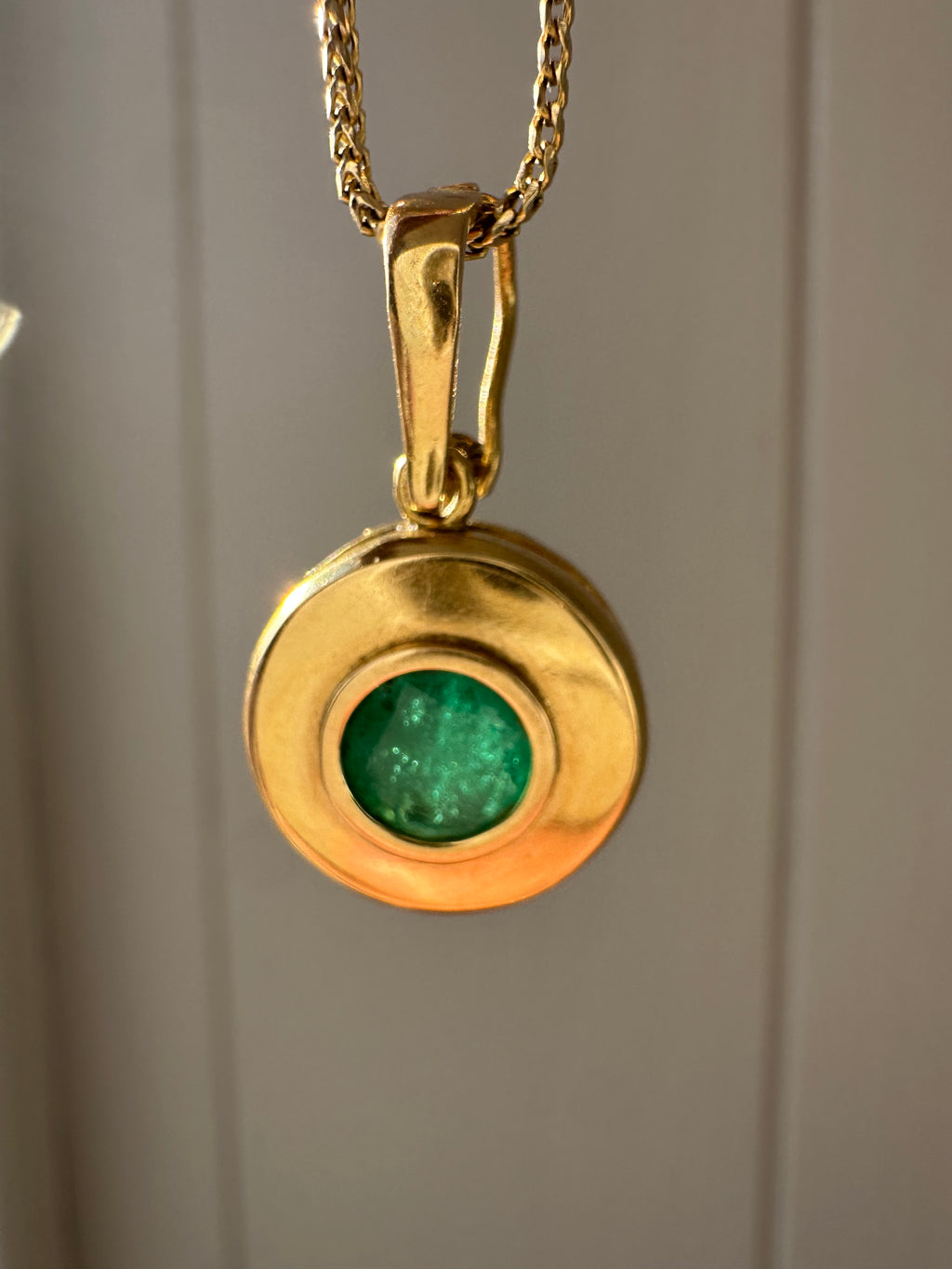 emerald in 18k bezel