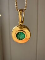 emerald in 18k bezel