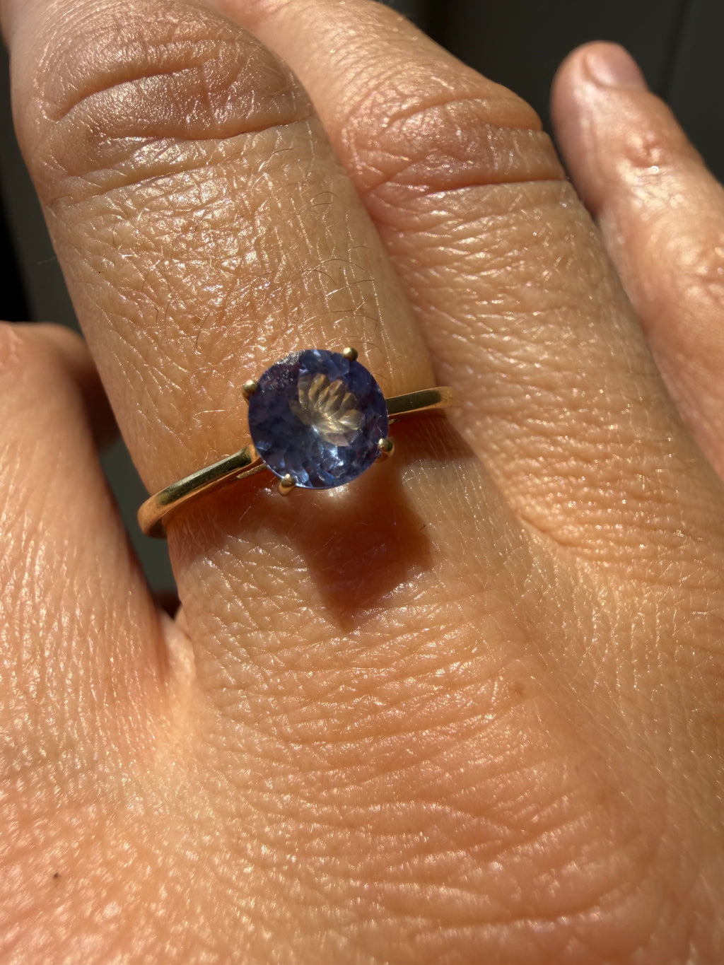 round cut solitaire tanzanite in 9k gold