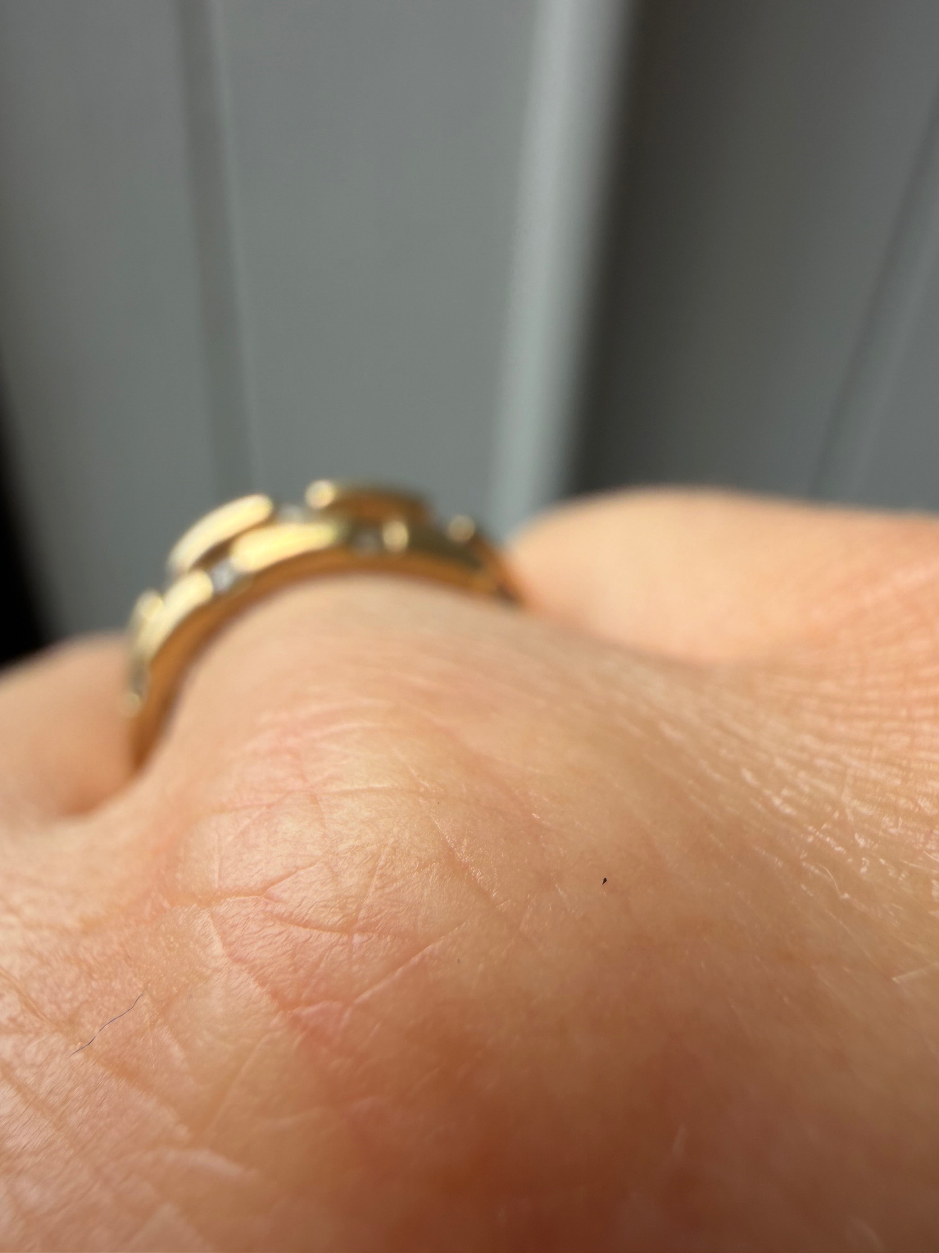triple gold band with spaced diamonds