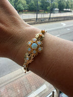 striking engraved opal burst hinge bangle