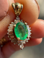 natural emerald and baguette diamond halo pendant