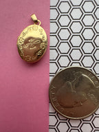 oval floral locket engraved H