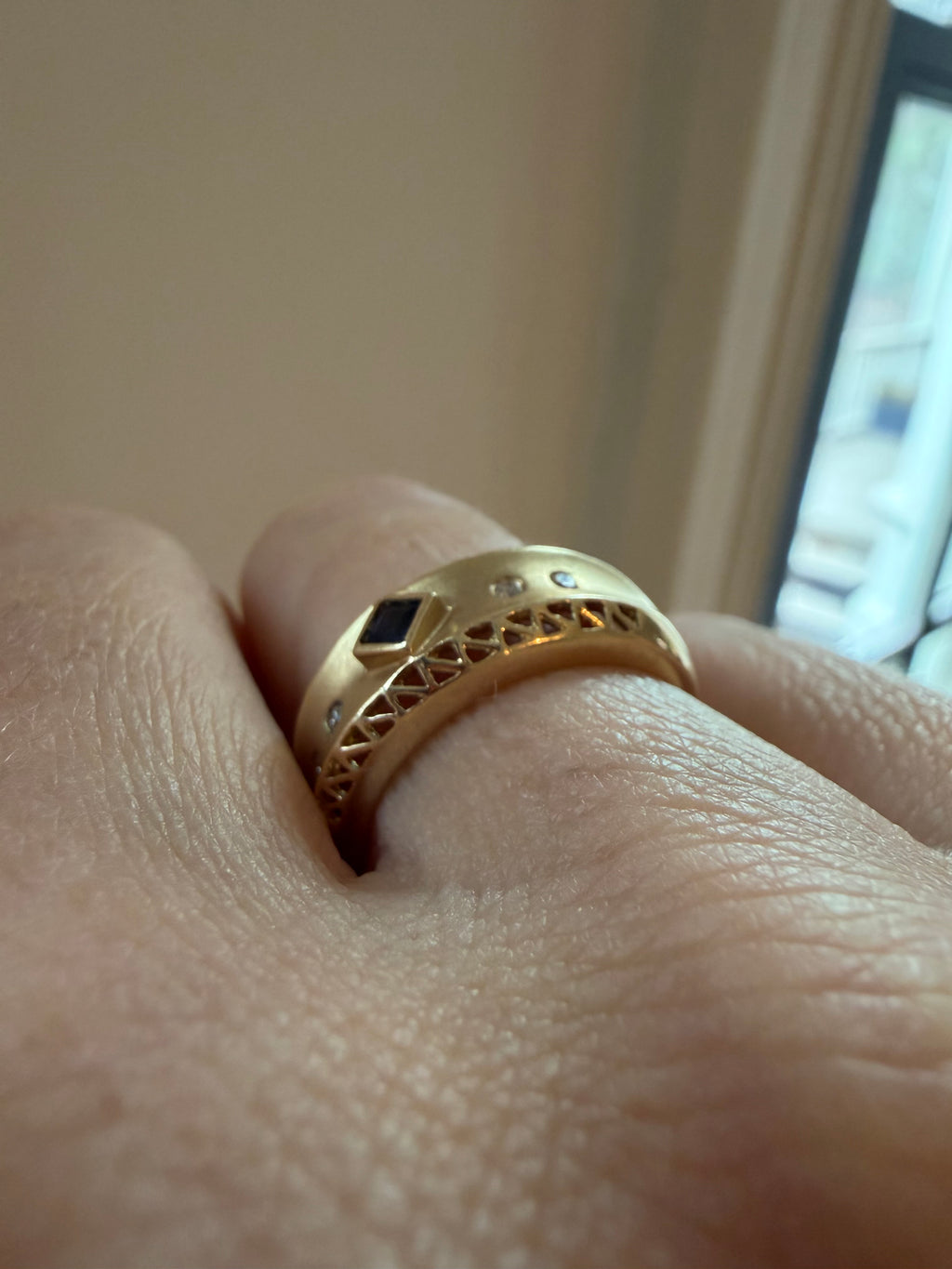 square cut sapphire and flush diamond ring