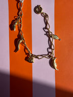 charm bracelet with whimsical girly charms
