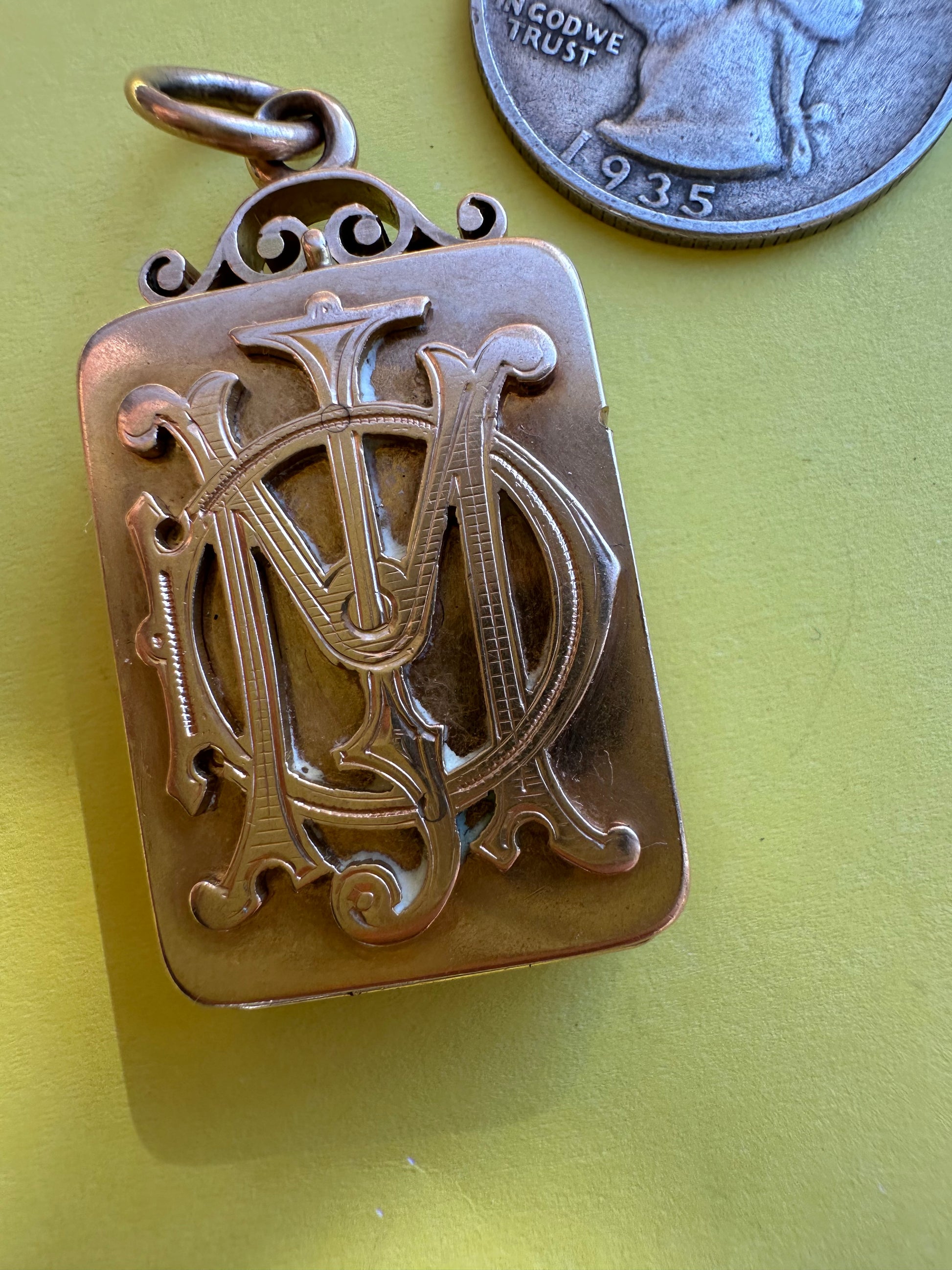 antique two sided locket with elk and monogram