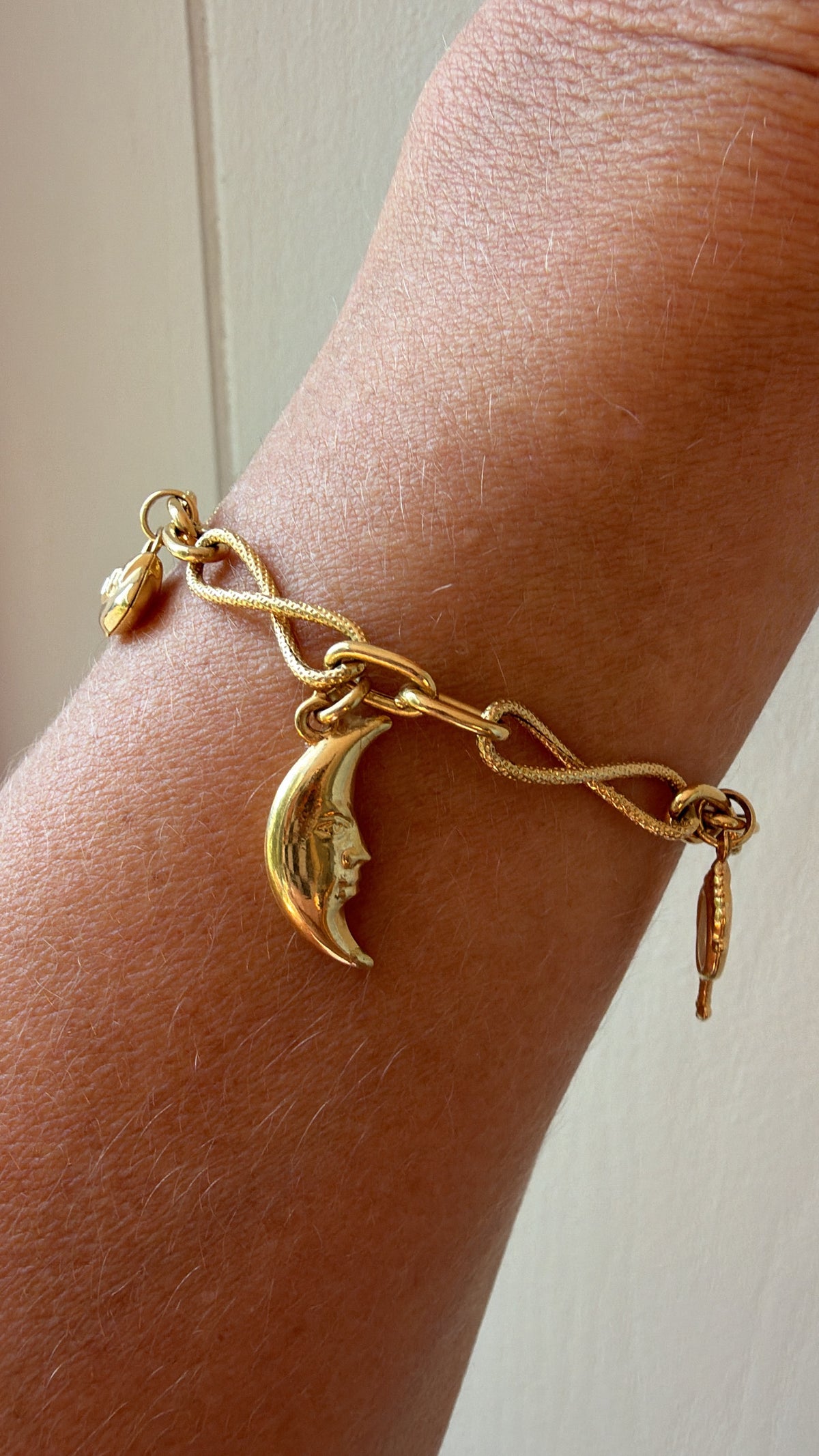charm bracelet with whimsical girly charms