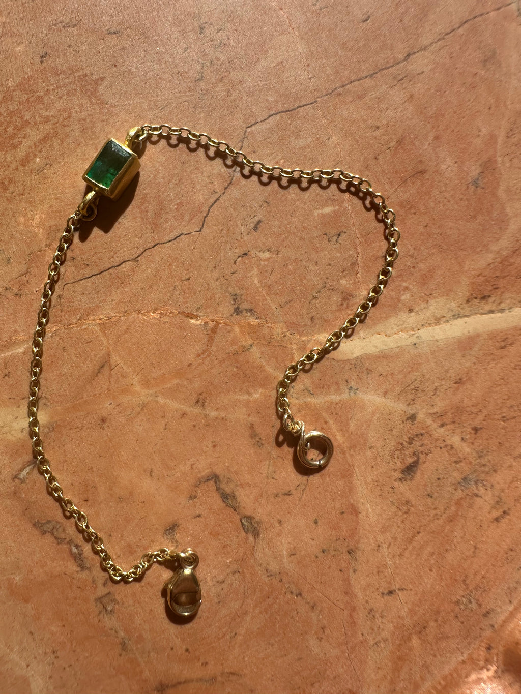 High karat gold and emerald bracelet