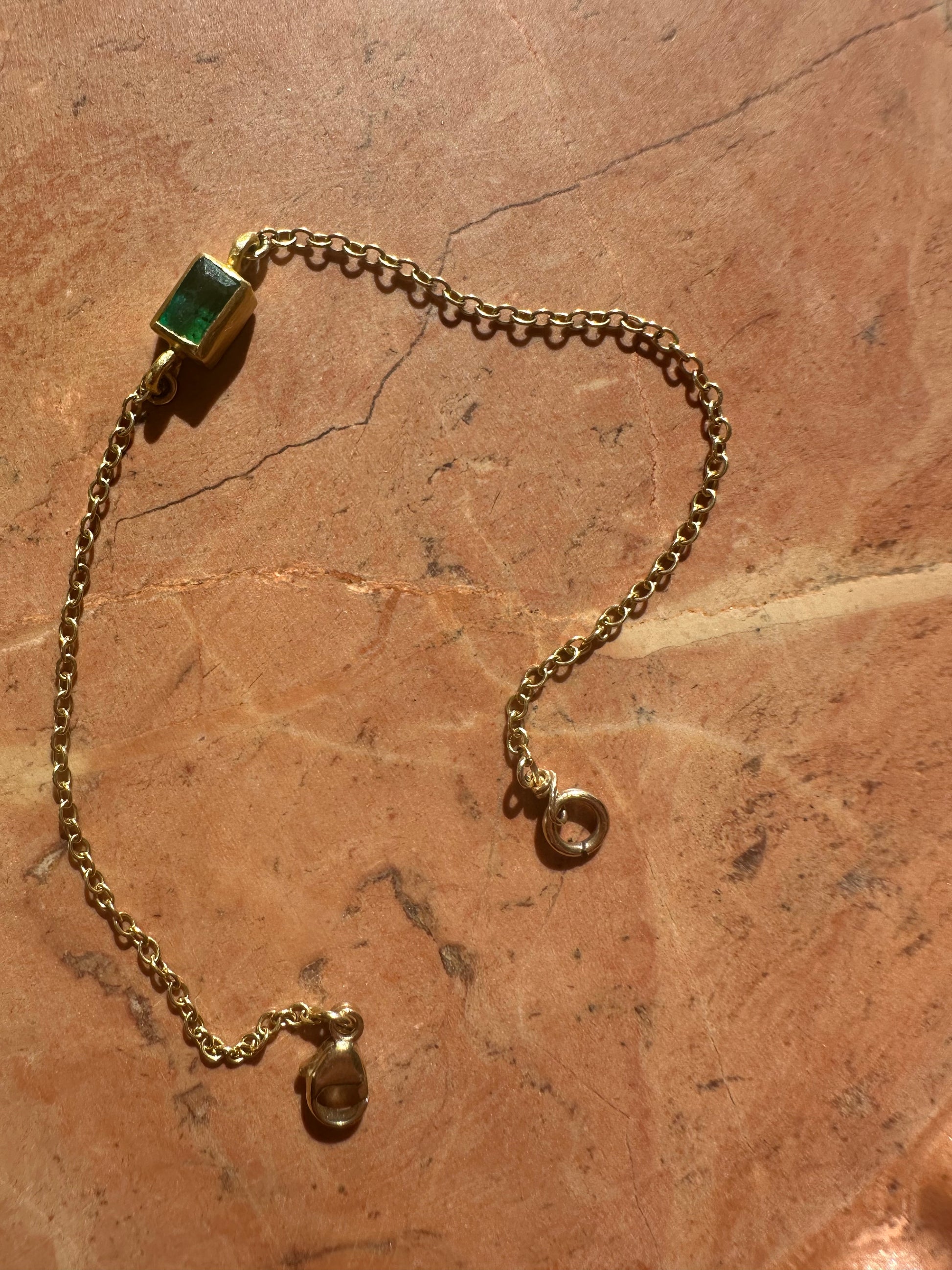 High karat gold and emerald bracelet