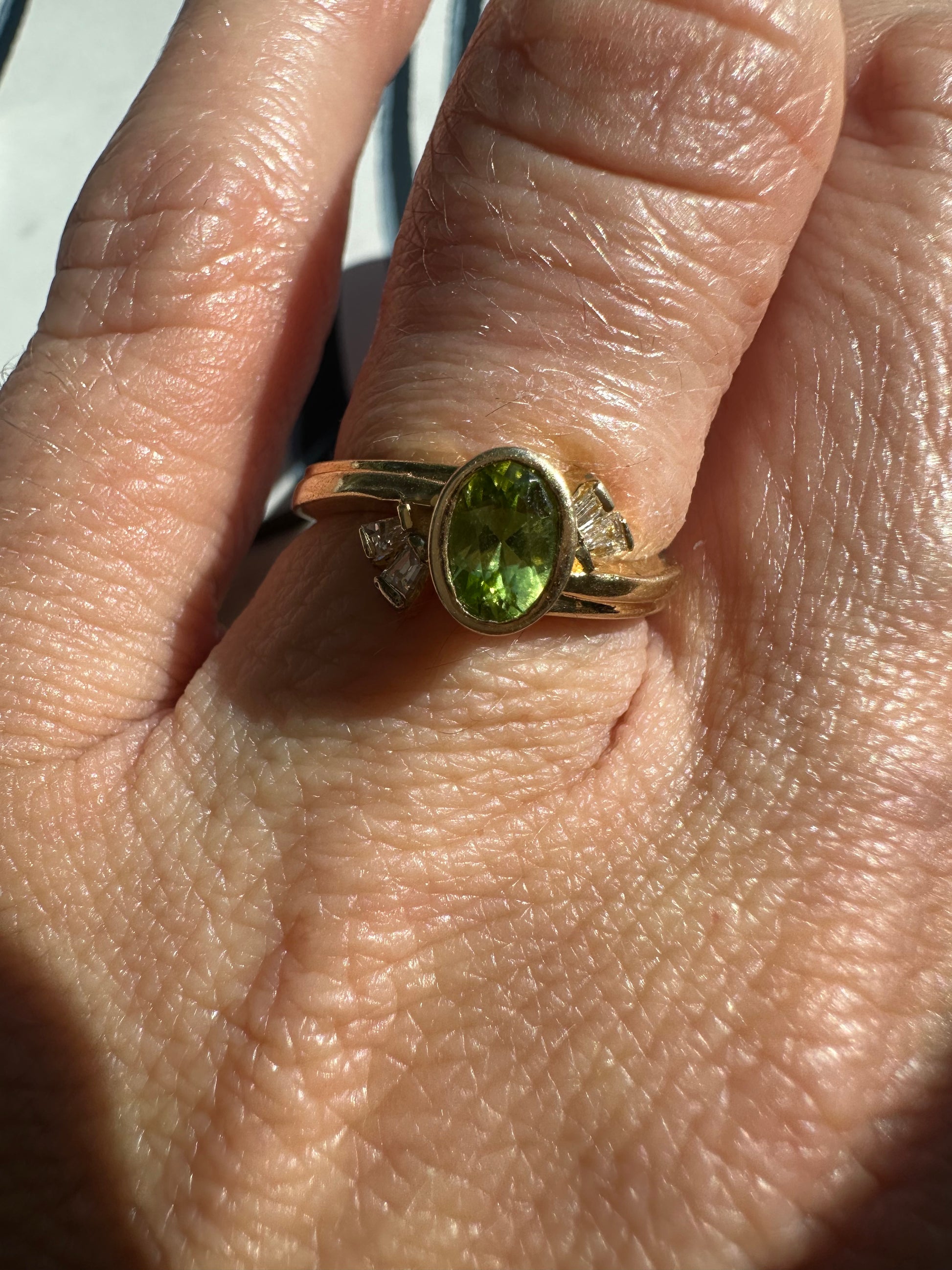bezel set peridot and diamond ring
