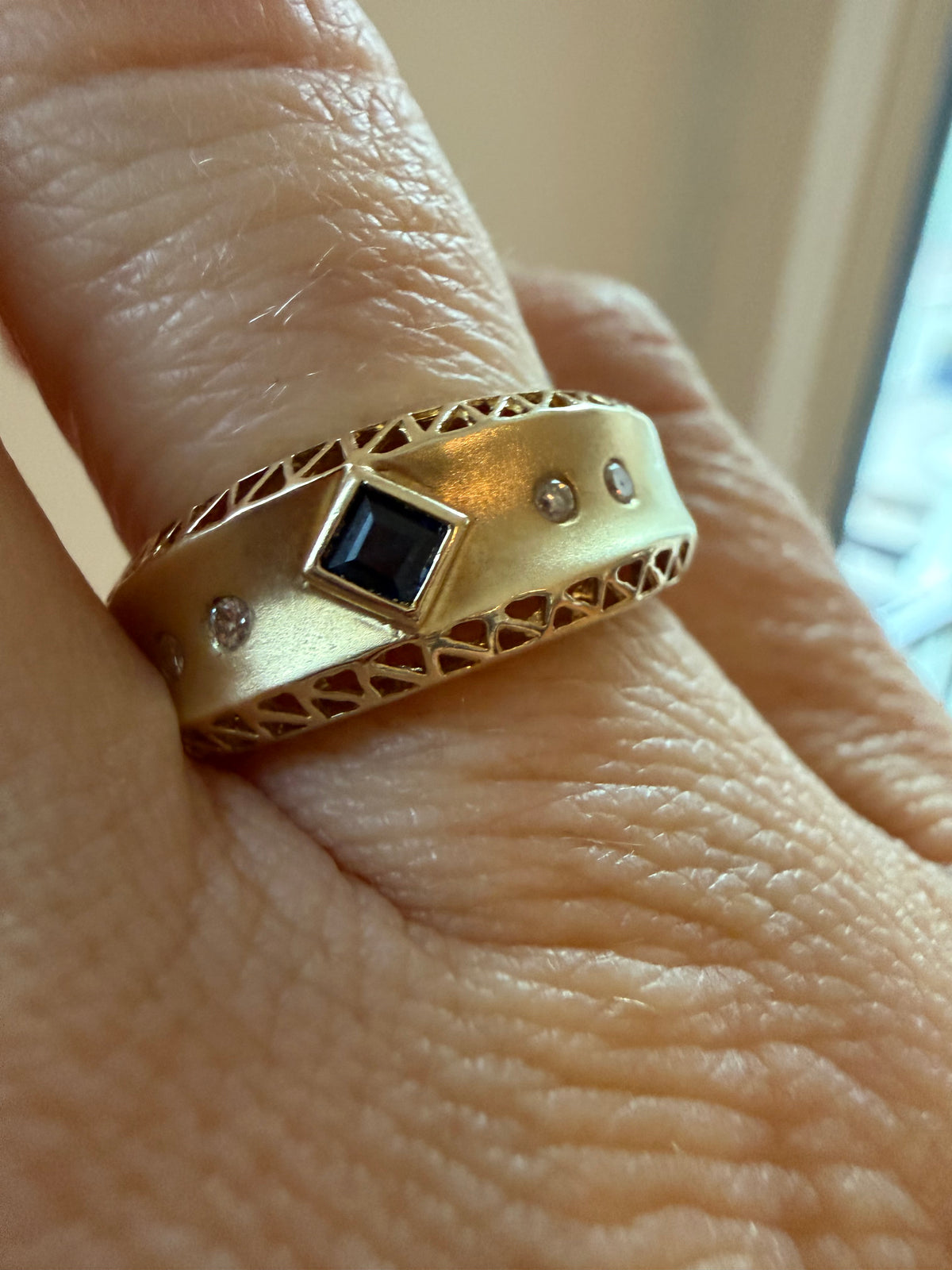 square cut sapphire and flush diamond ring