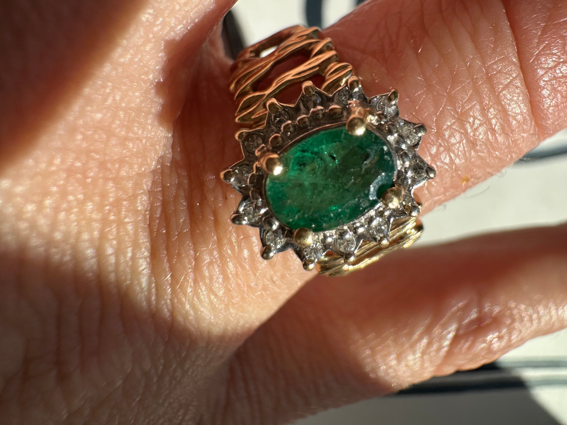 oval cut emerald with diamond halo