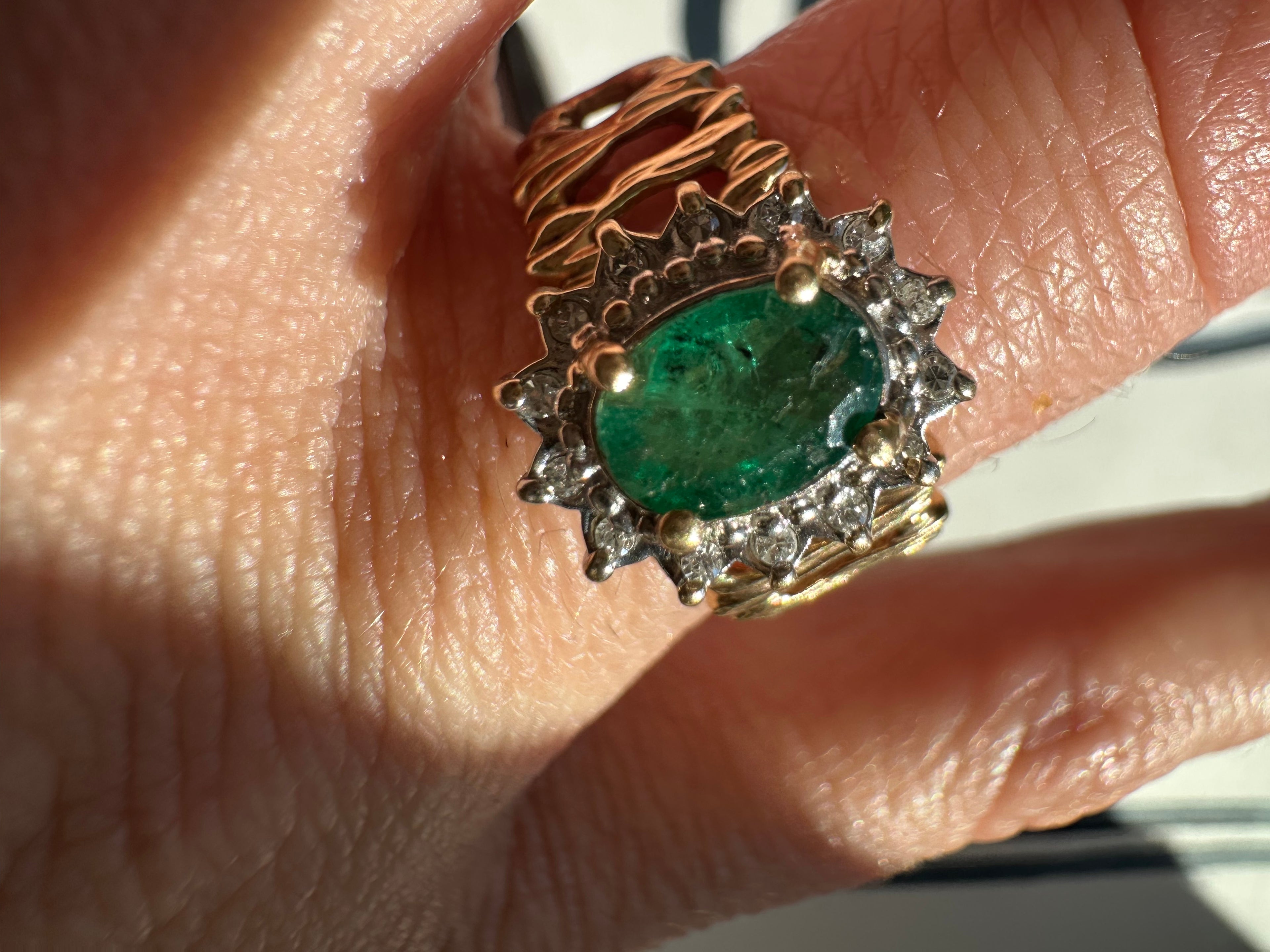 oval cut emerald with diamond halo