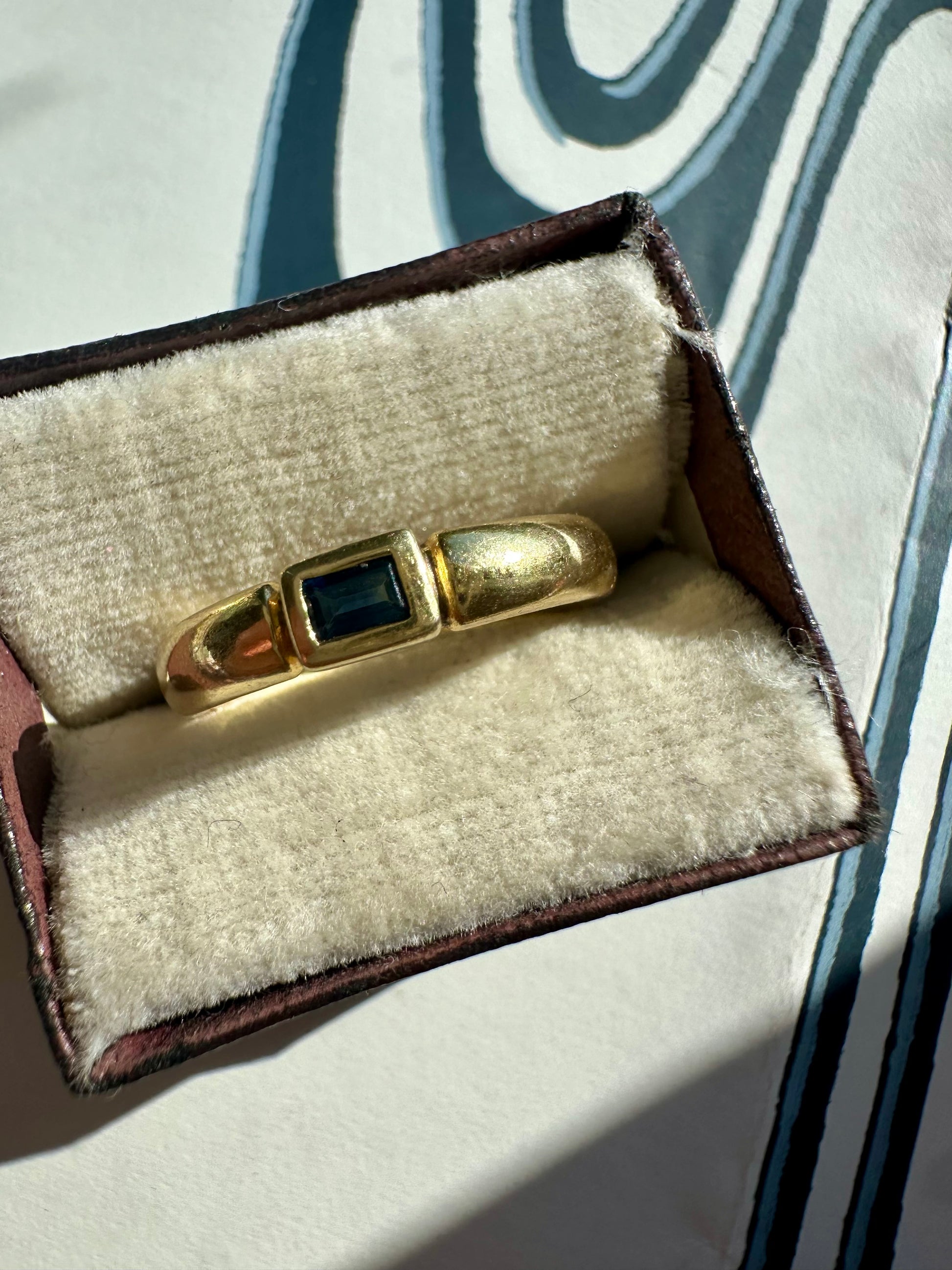 east west bezel set sapphire band