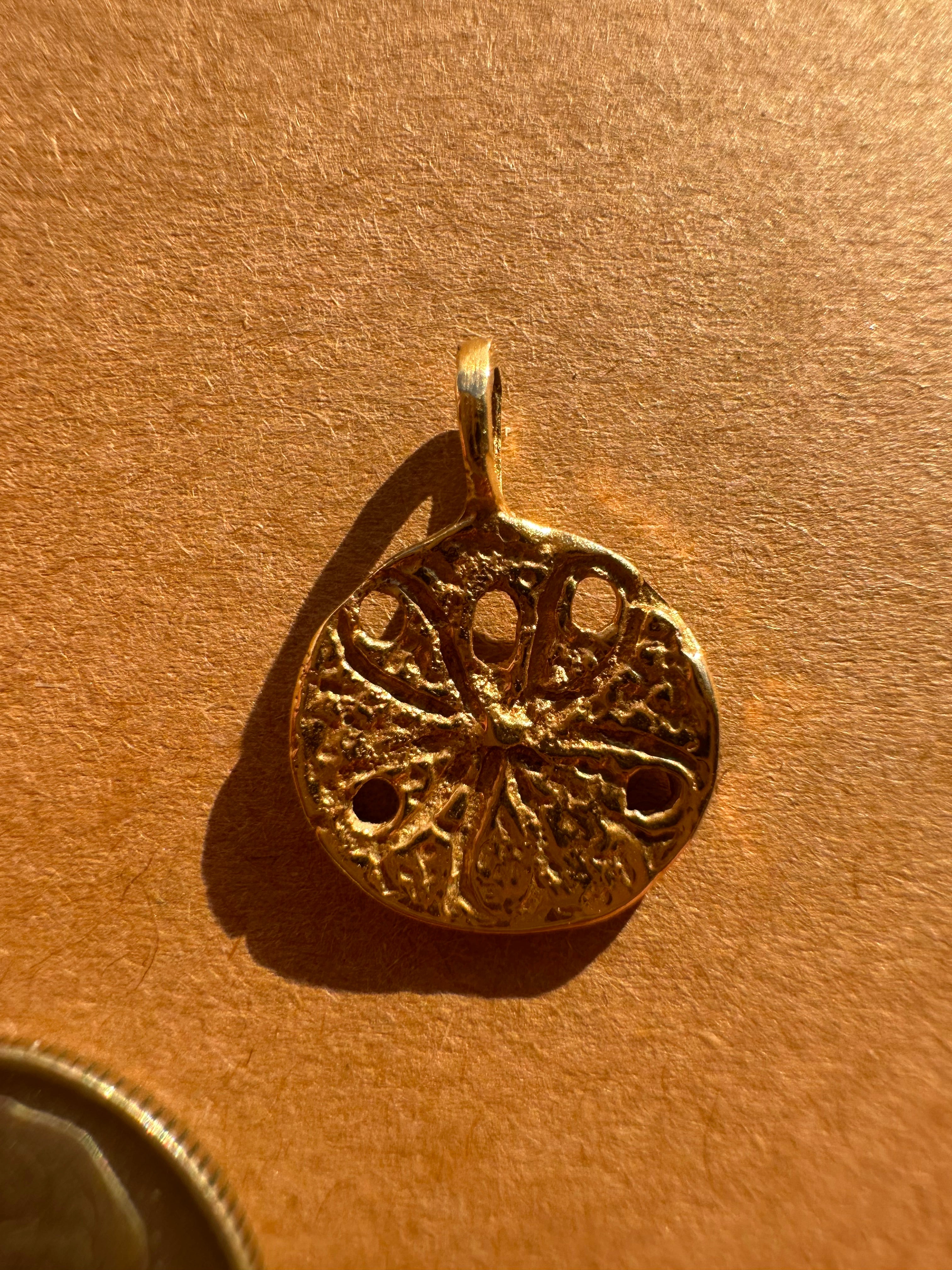 sanddollar - zuni bear - fluted clover charm