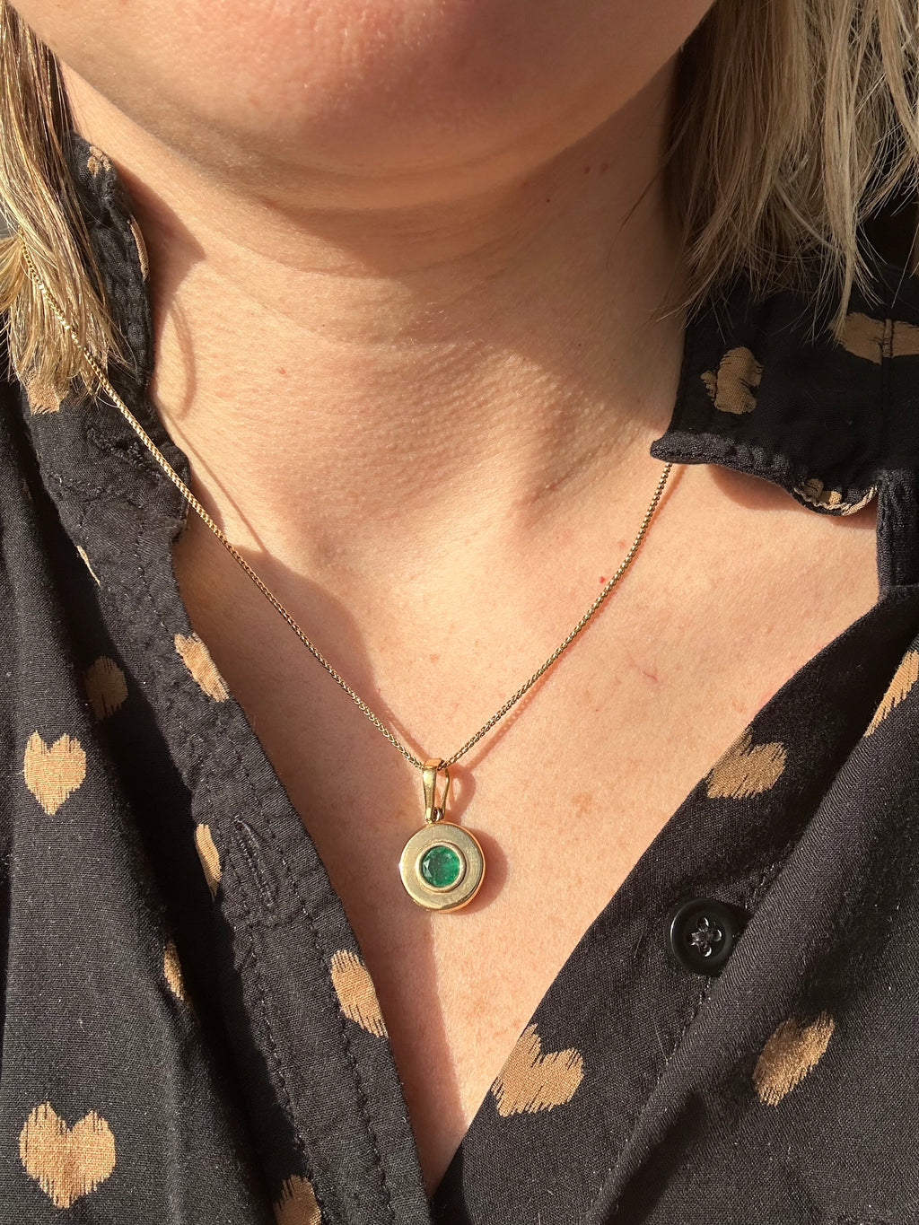 emerald in 18k bezel