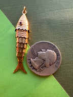 big articulated fish with ruby eyes