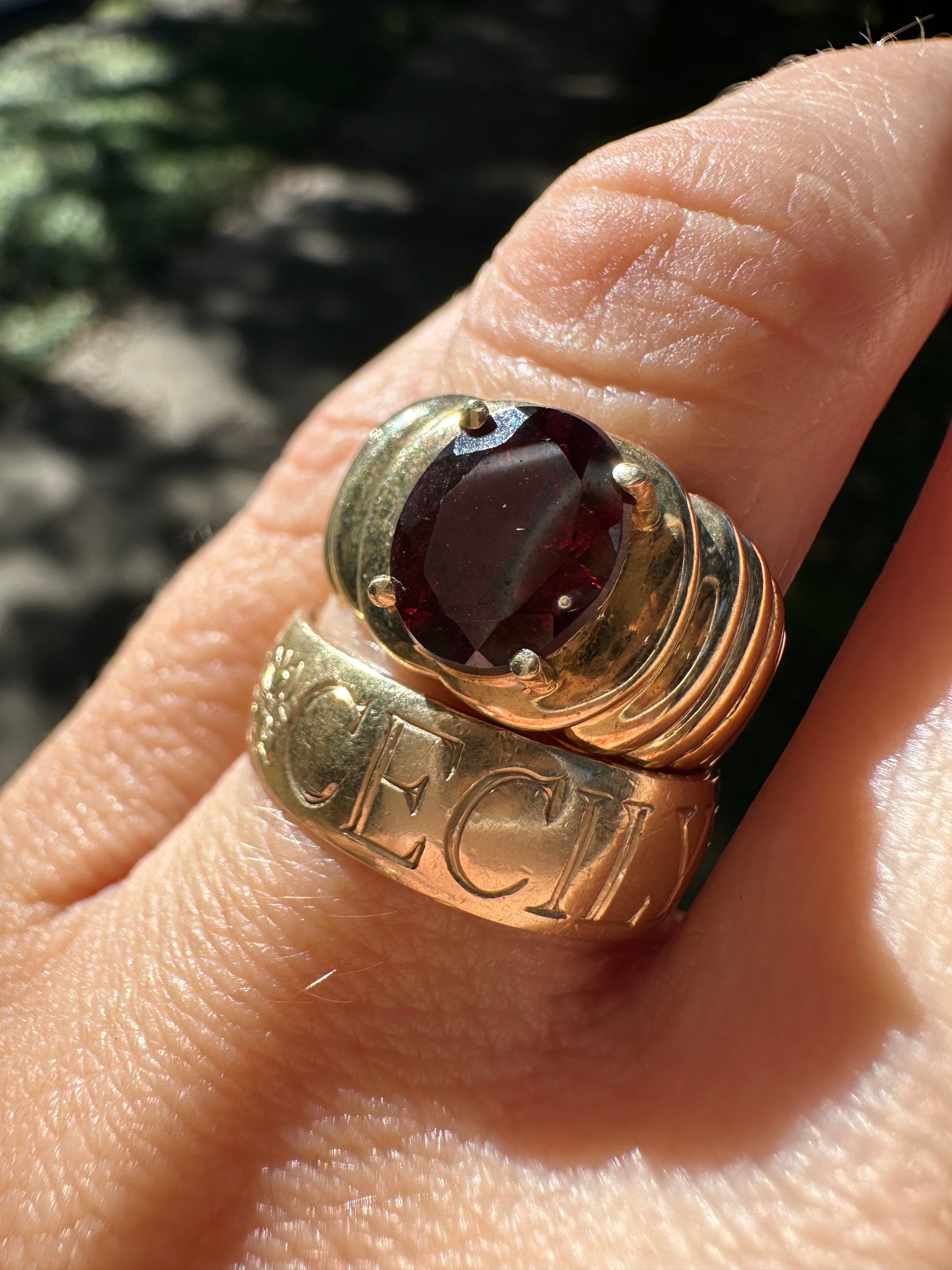 oval garnet in ribbed gold