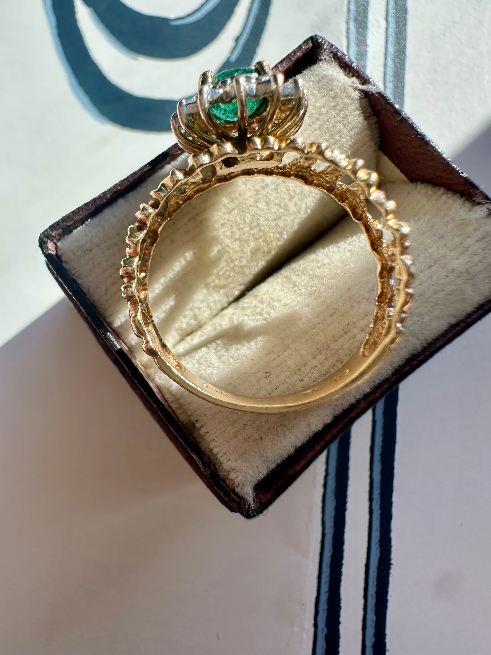 oval cut emerald with diamond halo