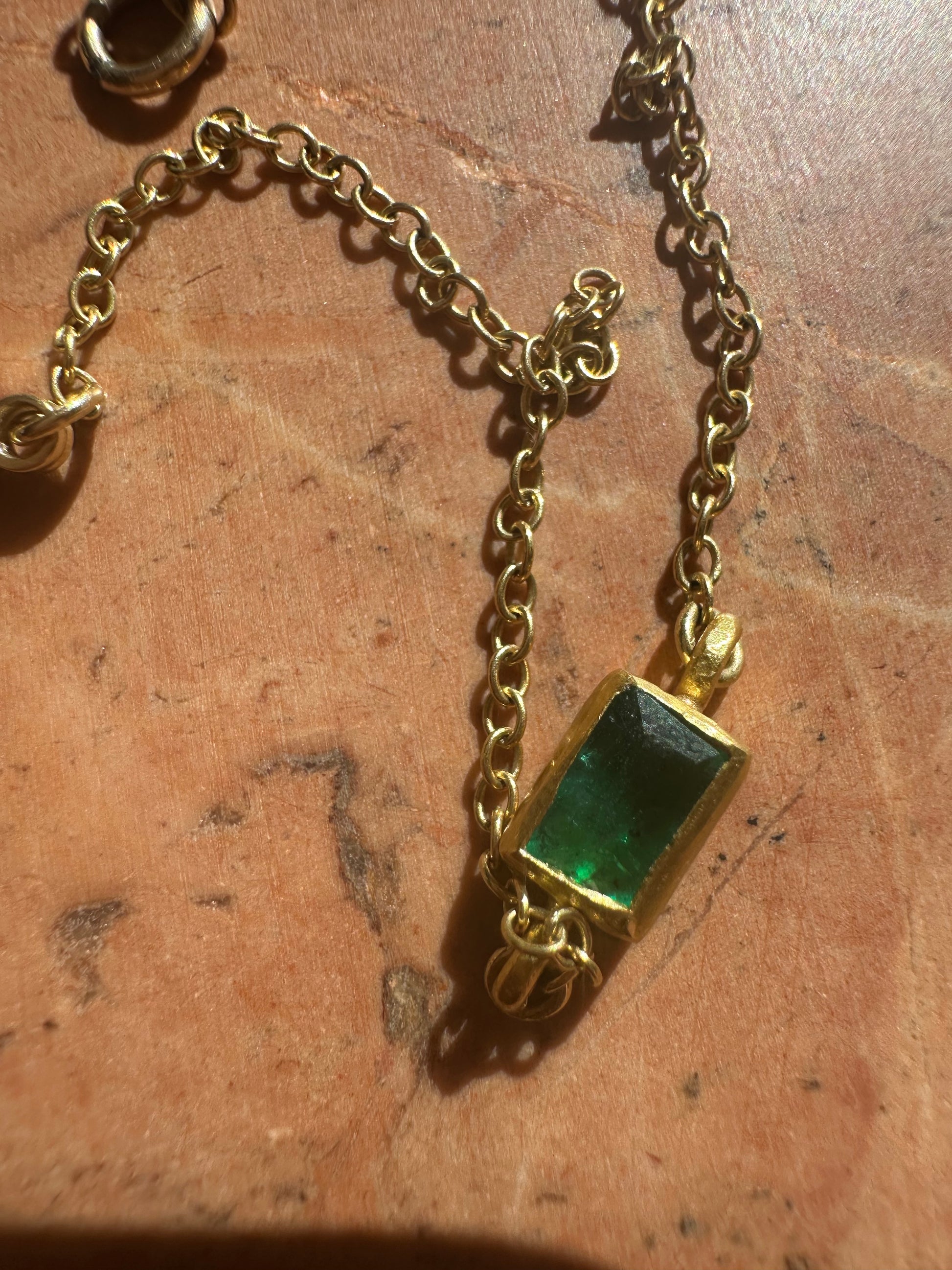 High karat gold and emerald bracelet