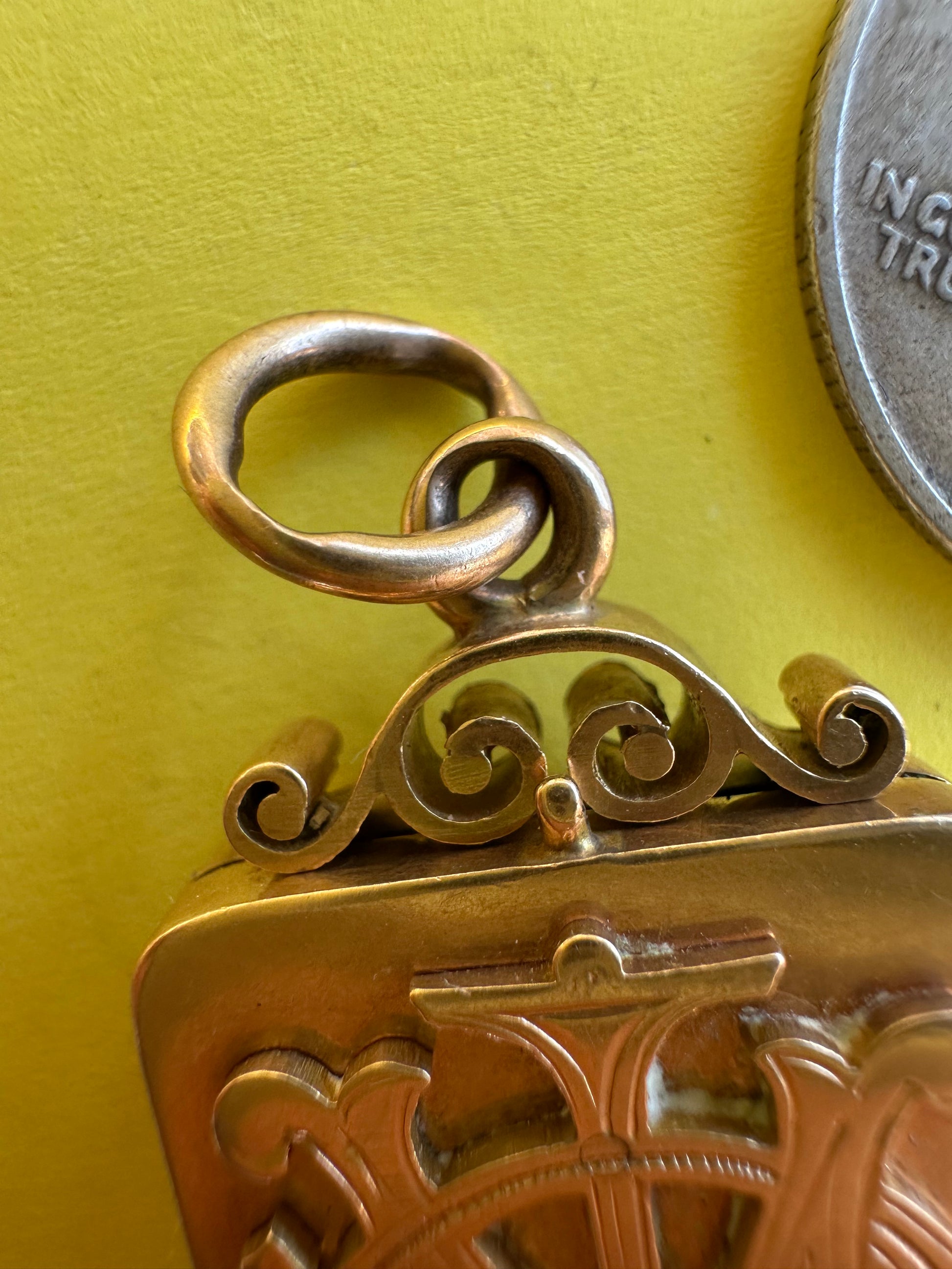 antique two sided locket with elk and monogram