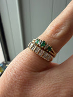 oval cut emerald and round cut diamond ring