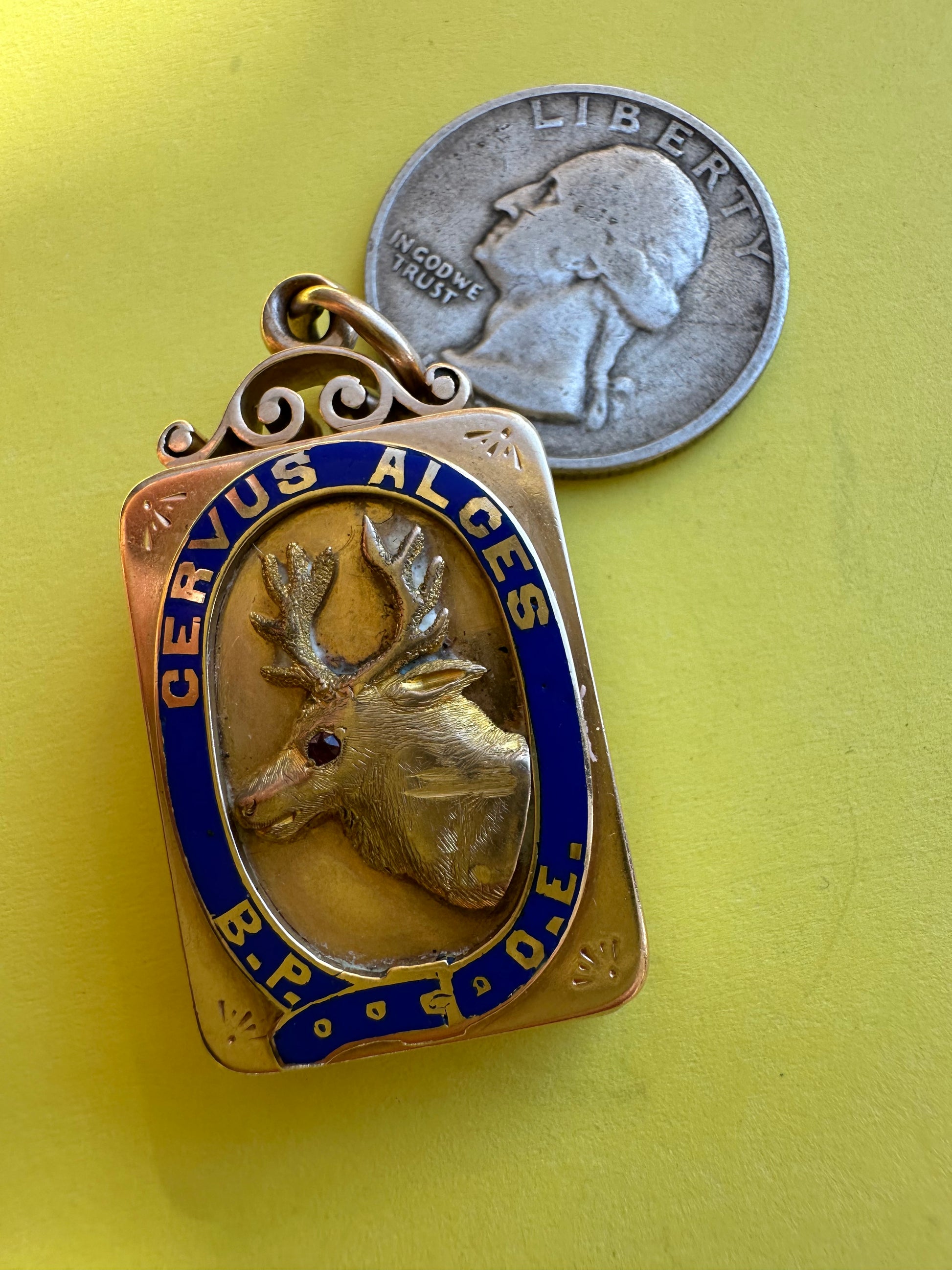 antique two sided locket with elk and monogram