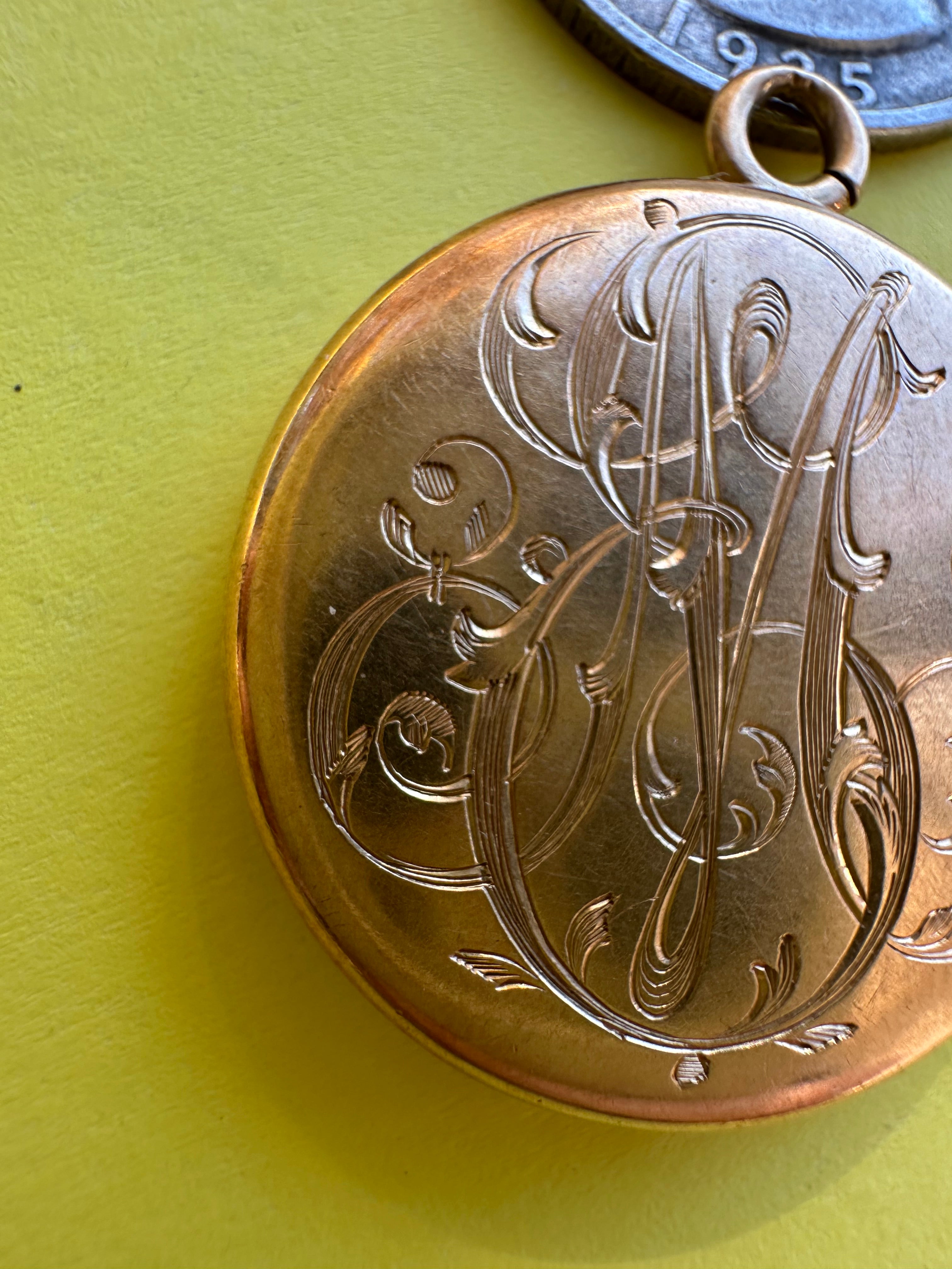 antique round engraved locket